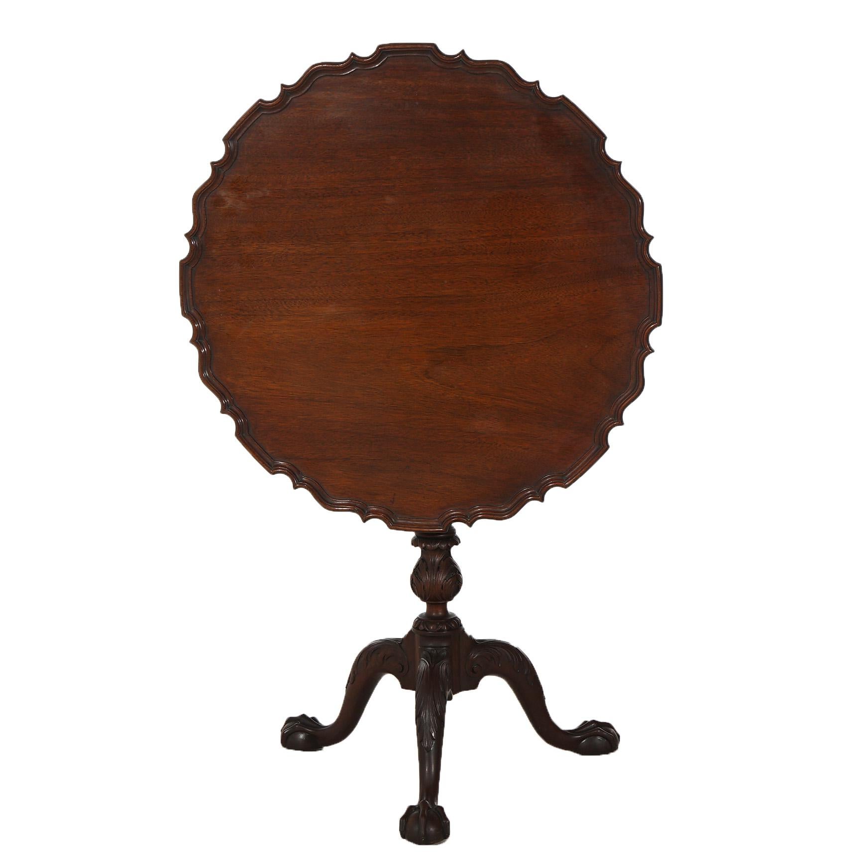 Antique Chippendale Carved Mahogany Pie Crust Tilt Top Table with Reeded Column and Carved Acanthus Cabriole Legs C1930

Measures- 28.25''H x 27.25''W x 27.25''D; 42.75'' H folded