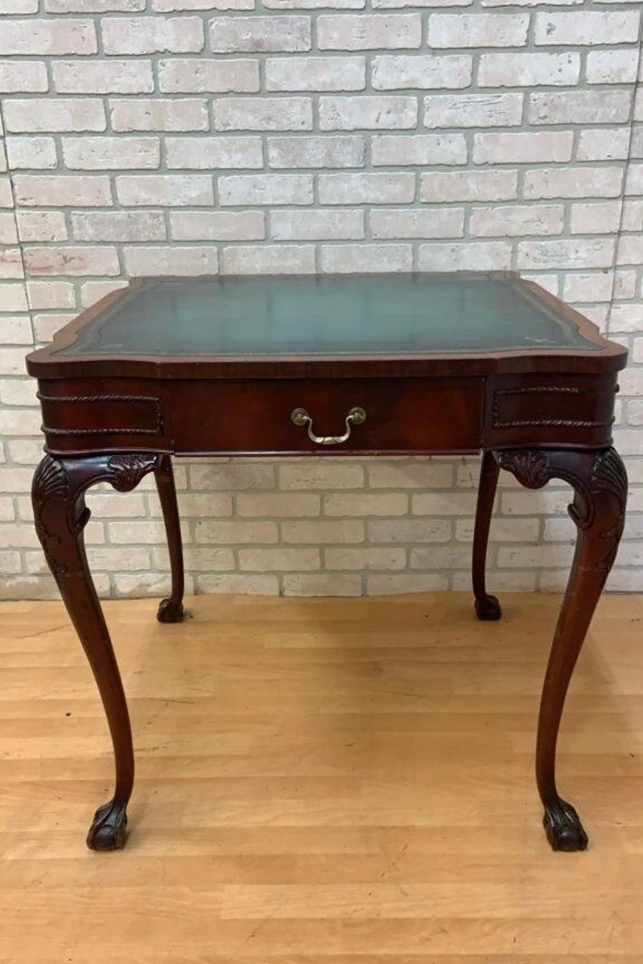 Antique Chippendale Carved Mahogany Single Drawer Leather Top Game Table

A superb antique Irish George II style serpentine mahogany leather-top card/game table. The frieze has a serpentine front drawer with a Rococo style swan neck handle and a