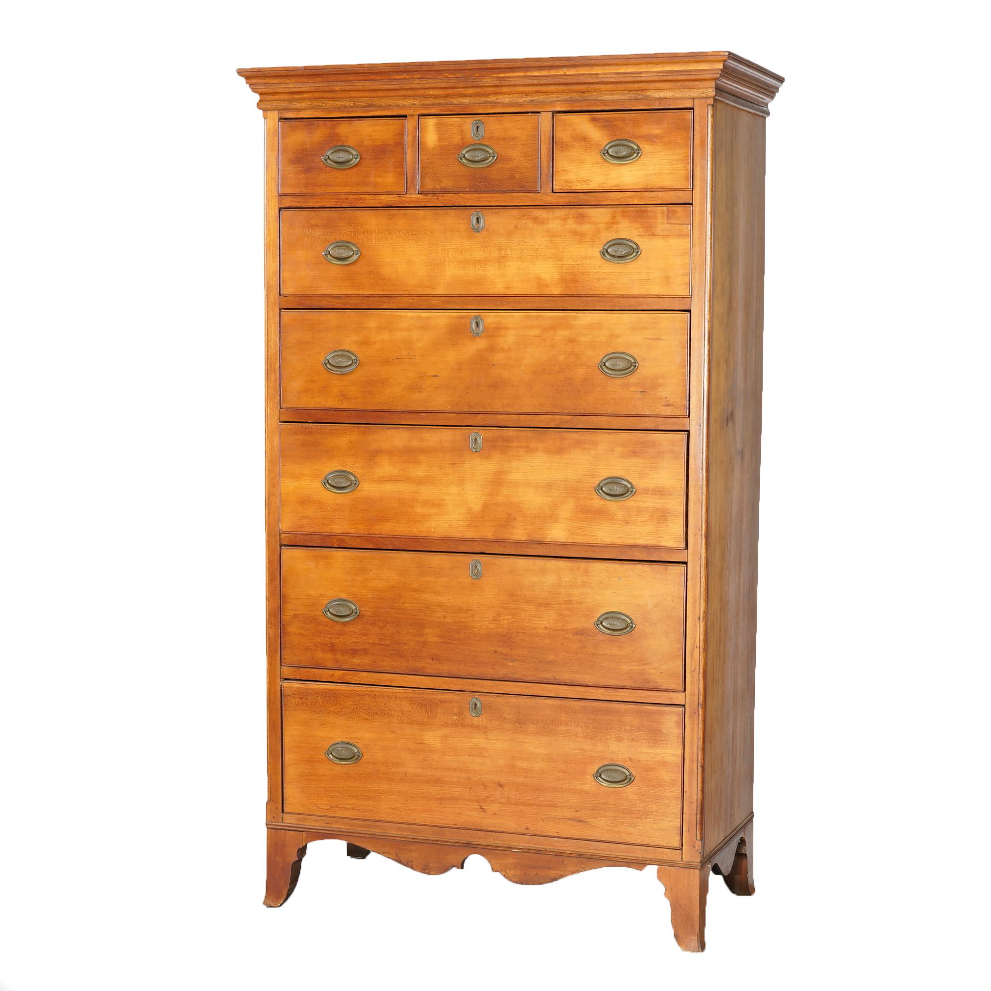 An antique Chippendale tall chest of drawers offers cherry construction with three small drawers over five graduated long drawers, c1820

Measures- 68.5'' H x 40.25'' W x 19.5'' D.