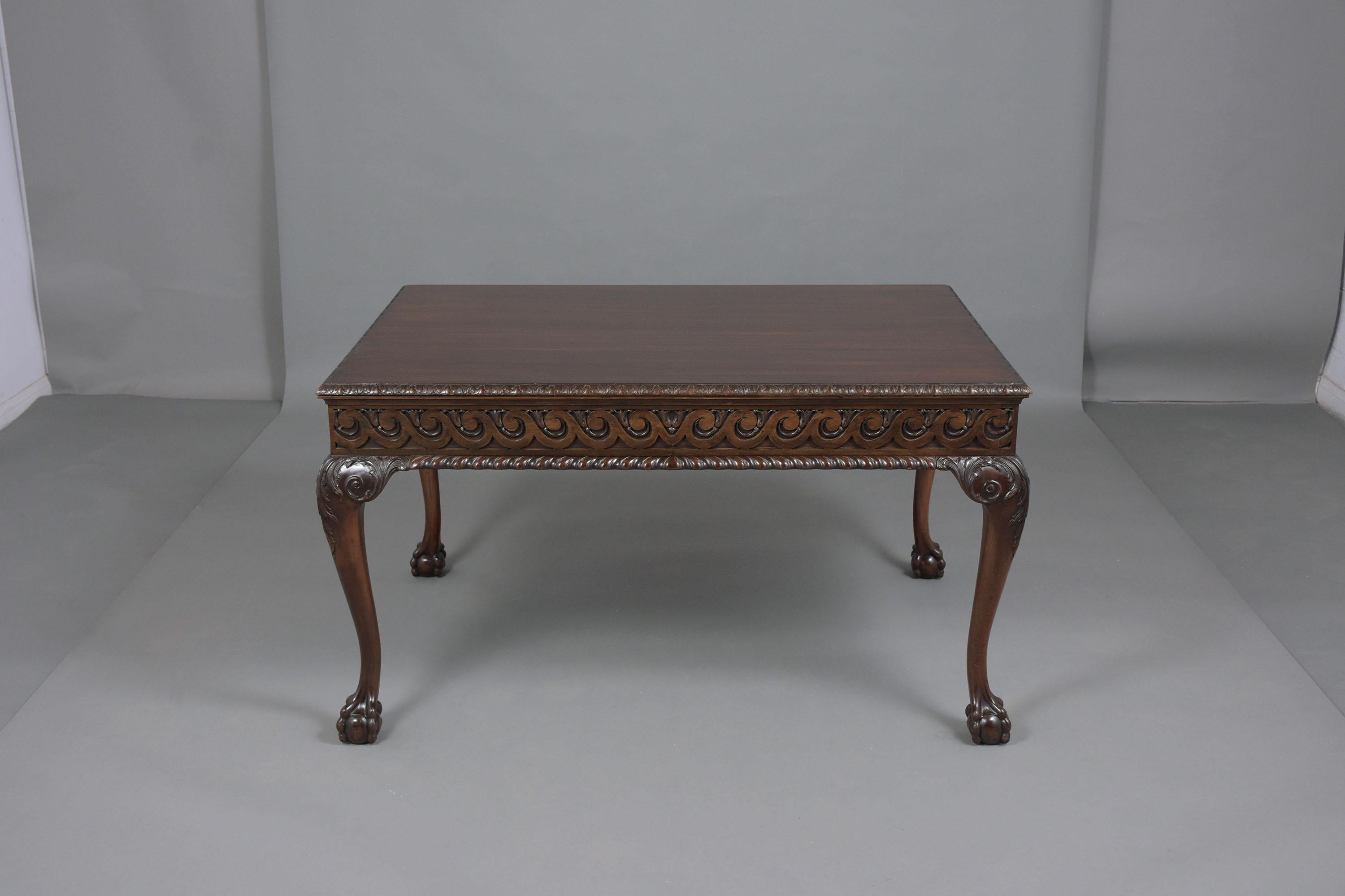 An extraordinary 1890s Chippendale desk hand-crafted out of mahogany wood in great condition with a dark walnut color stain newly waxed and polished giving it a beautiful patina finish. This writing table features a rectangular top with carved