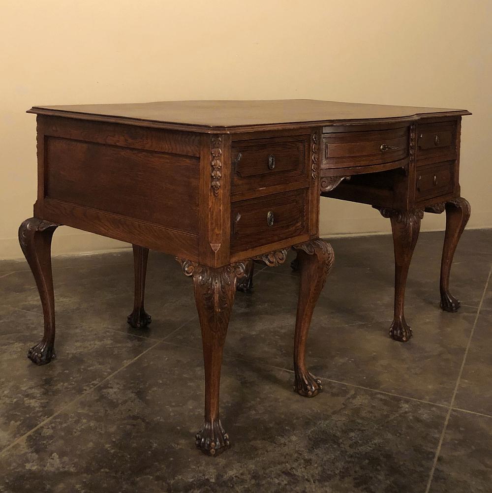 Antique chippendale double sided desk is as elegant and graceful as they come, yet with its relatively tailored lines and solid oak construction, can work with a more casual decor as well! The spacious top follows the contours of the casework below