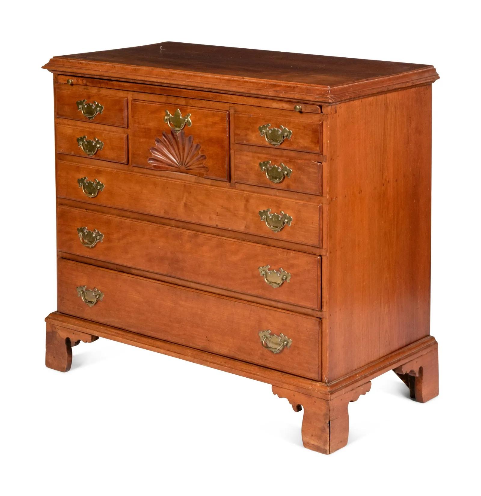 Antique American Chippendale Fan-Carved Walnut Bachelor's Chest. Likely New England, 19th Century. The fan-carved drawer flanked by 2 drawers on either side and above three long graduated drawers. This chest incorporates earlier elements. Excellent