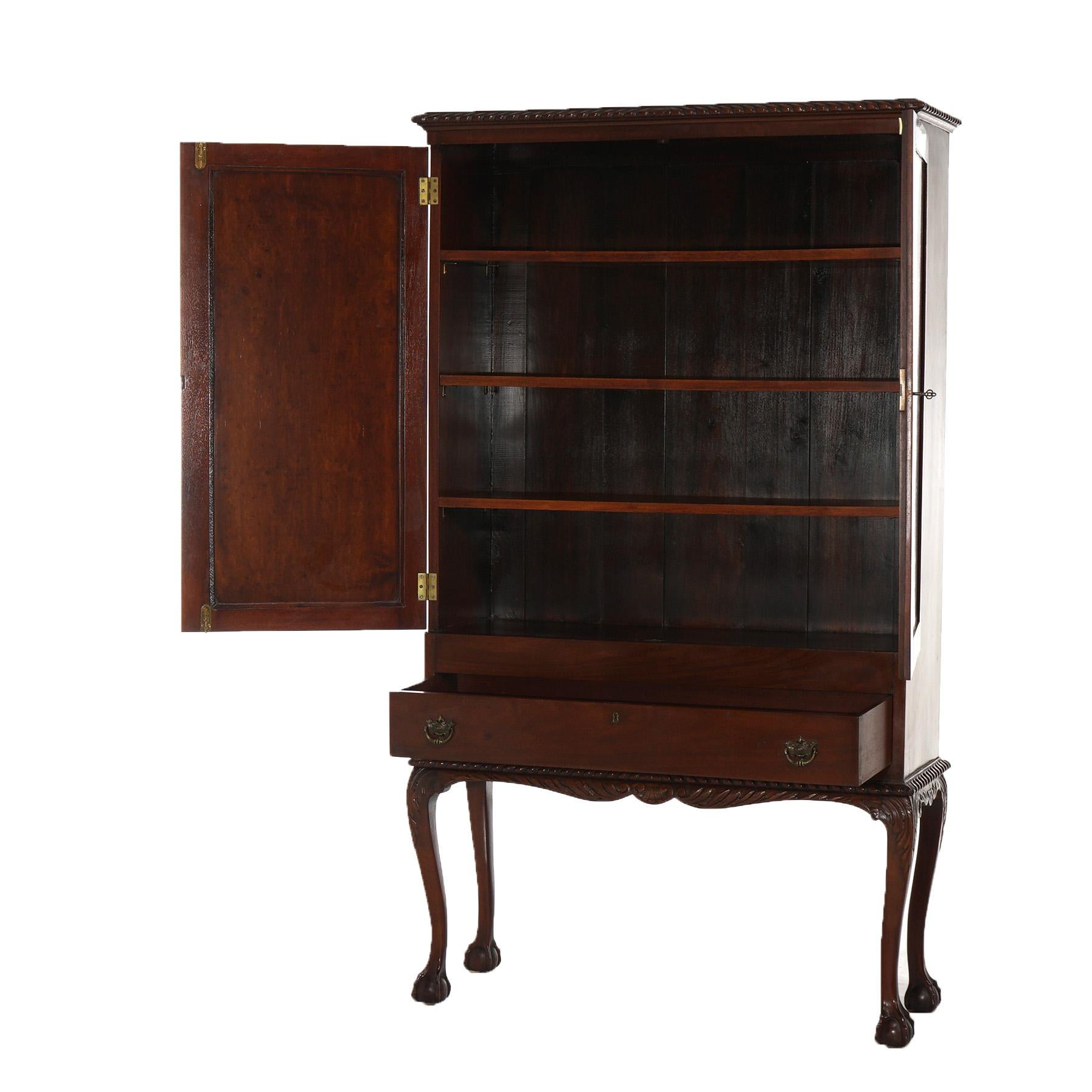 ***Ask About Reduced In-House Shipping Rates - Reliable Service & Fully Insured***
An antique Chippendale credenza offers mahogany construction with double door case opening to shelved interior and over single long drawer; gadroon edge surmounts