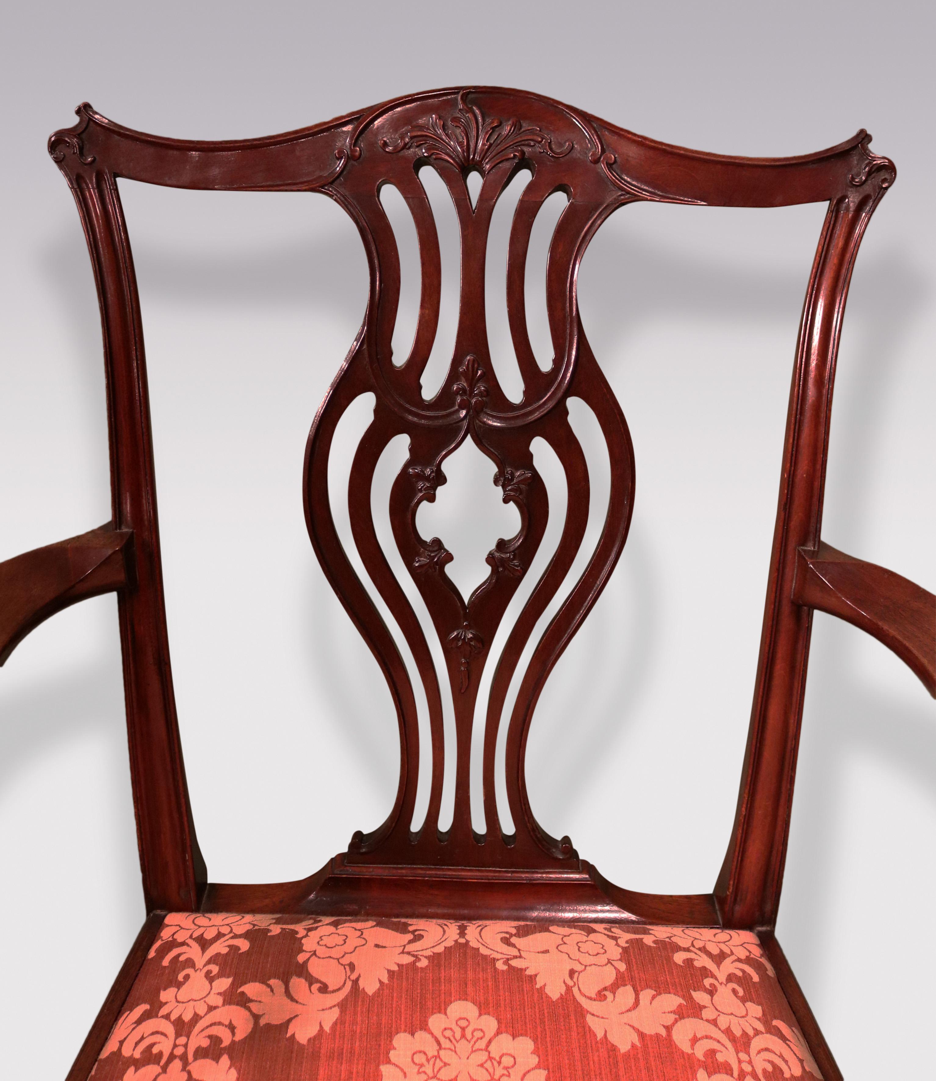 A mid-18th Century Chippendale period mahogany Armchair having serpentine top-rail with pierced & carved central splat with setback moulded arms and drop-in seat supported on chamfered legs with “H” stretcher.