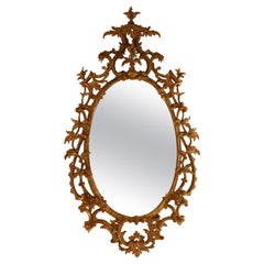 Antique Mirror ovale in legno intagliato dorato del periodo Chippendale