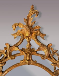 Antique Chippendale period oval carved wood and gilded mirror