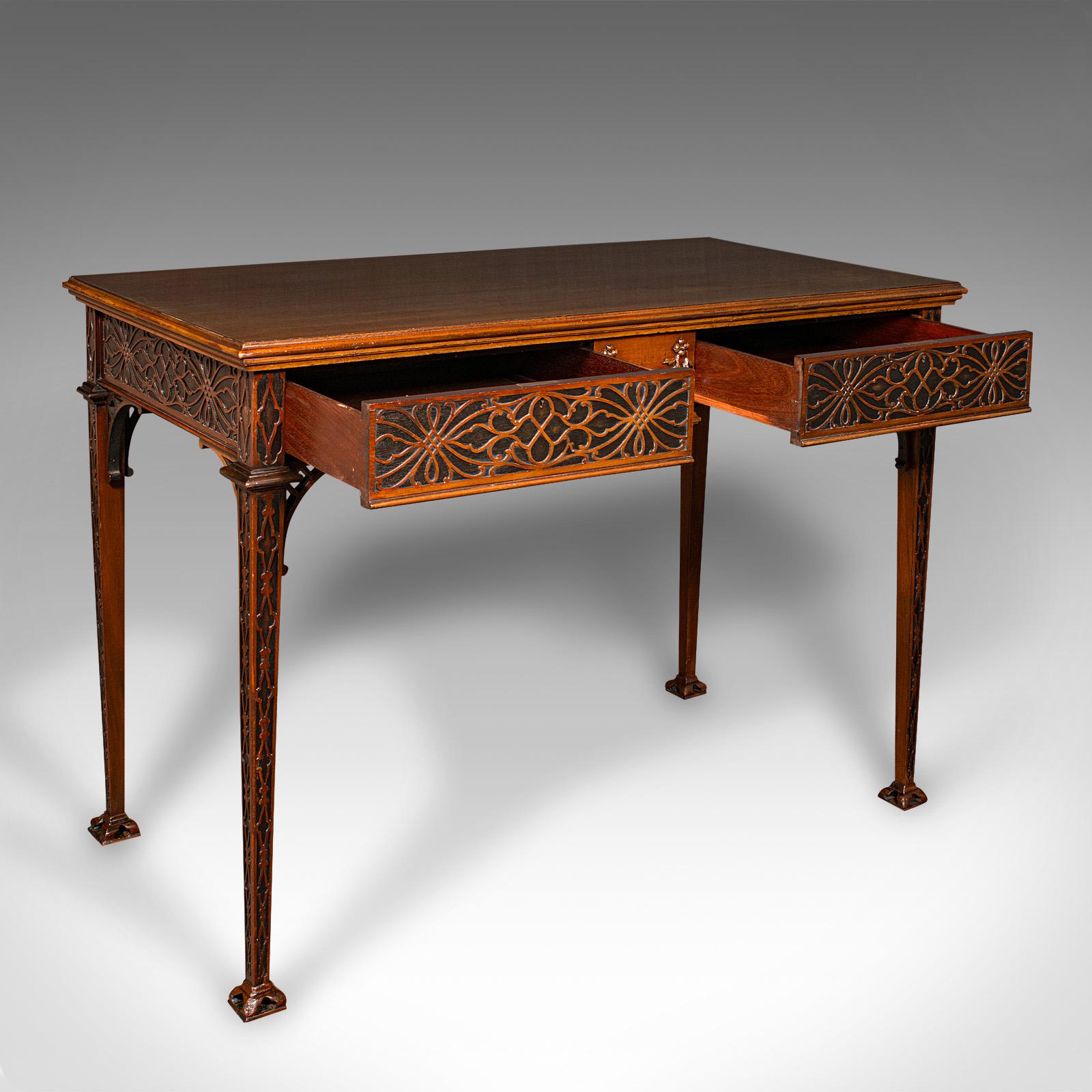 
This is an antique Chippendale revival side table. An English, mahogany console, hall or writing table, dating to the Edwardian period, circa 1910.

A treat of fretwork decoration and of a generous size for use throughout the home
Displays a