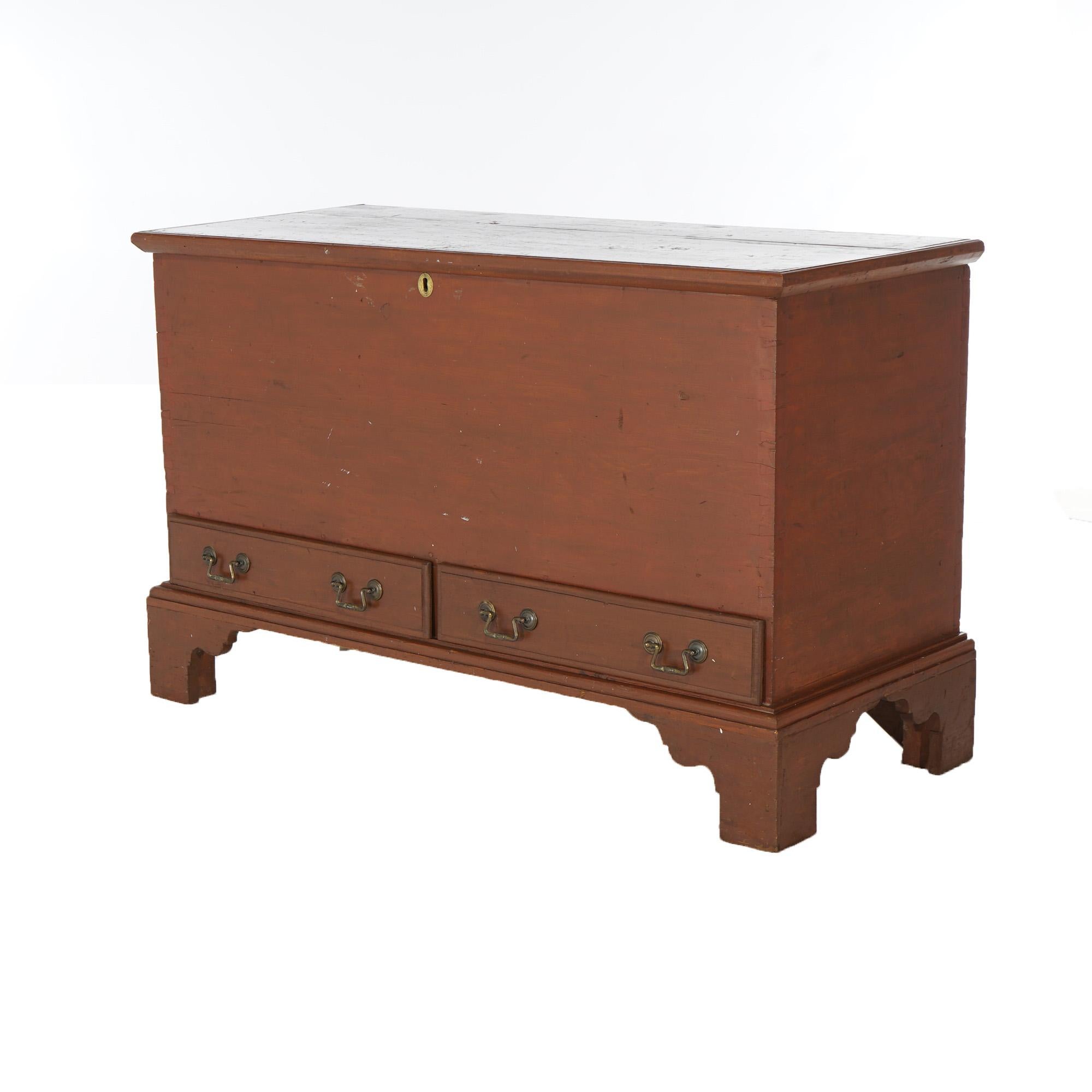 An antique Chippendale blanket chest offers soft wood construction with lift top having iron strap hinges and over two drawers, raised on bracket feet, c1830

Measures - 30