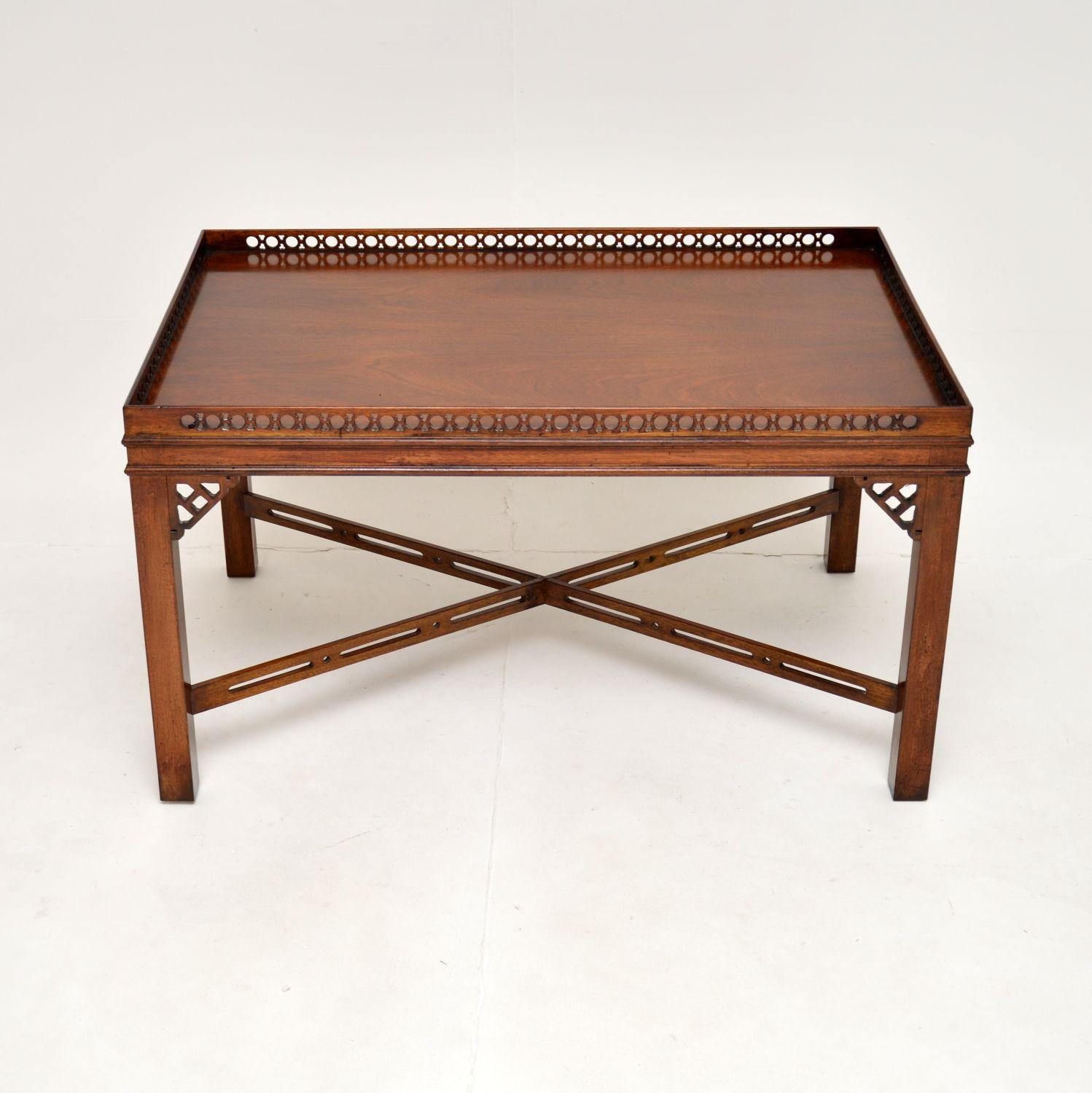 A very smart and well made antique Chippendale style coffee table. This was made in England, it dates from around the 1950’s.

The quality is superb, this has a beautiful pierced fretwork gallery around the top edge, with more lovely fretwork under