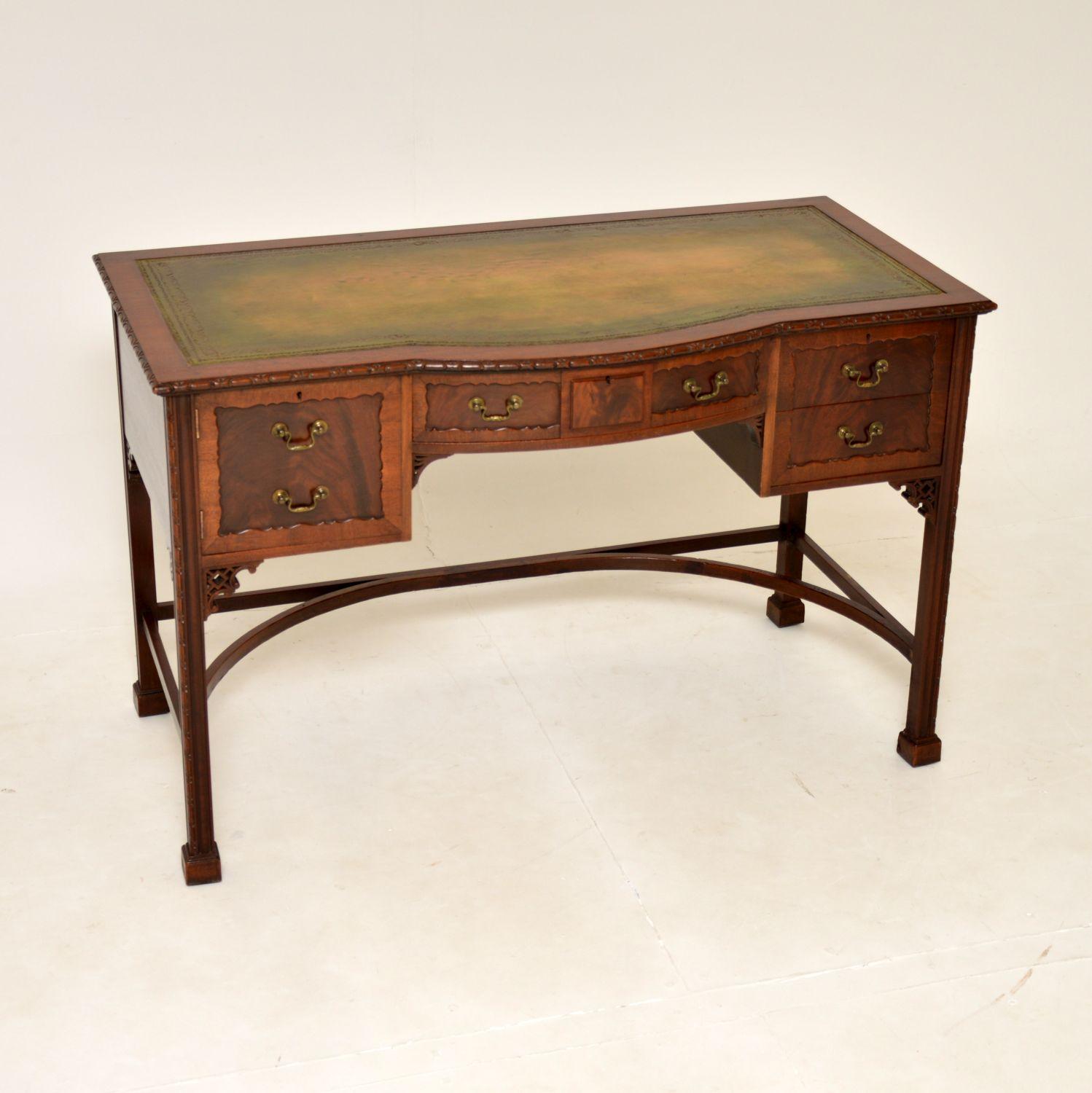 A superb antique leather top desk in the Chippendale style. This was made in England, it dates from around the 1890-1900 period.

It is of incredibly fine quality, with lots of lovely features. The fronts are recessed with lovely bordered patterns,