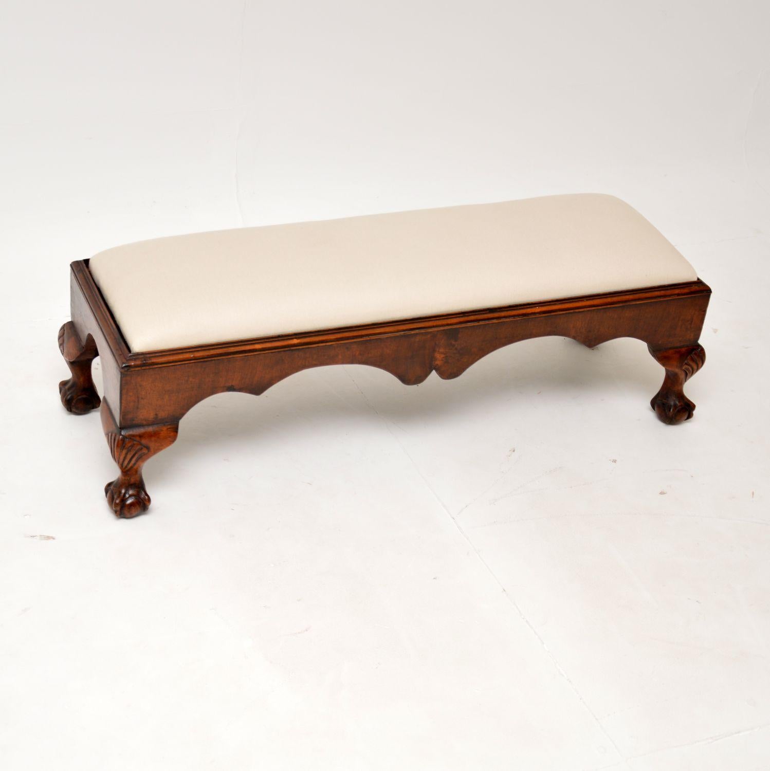 A lovely antique Chippendale Style low foot stool in walnut. This was made in England, it dates from around the 1880-1900 period & is full of character.

It is of excellent quality, with a beautifully shaped edge and a drop in seat that would be