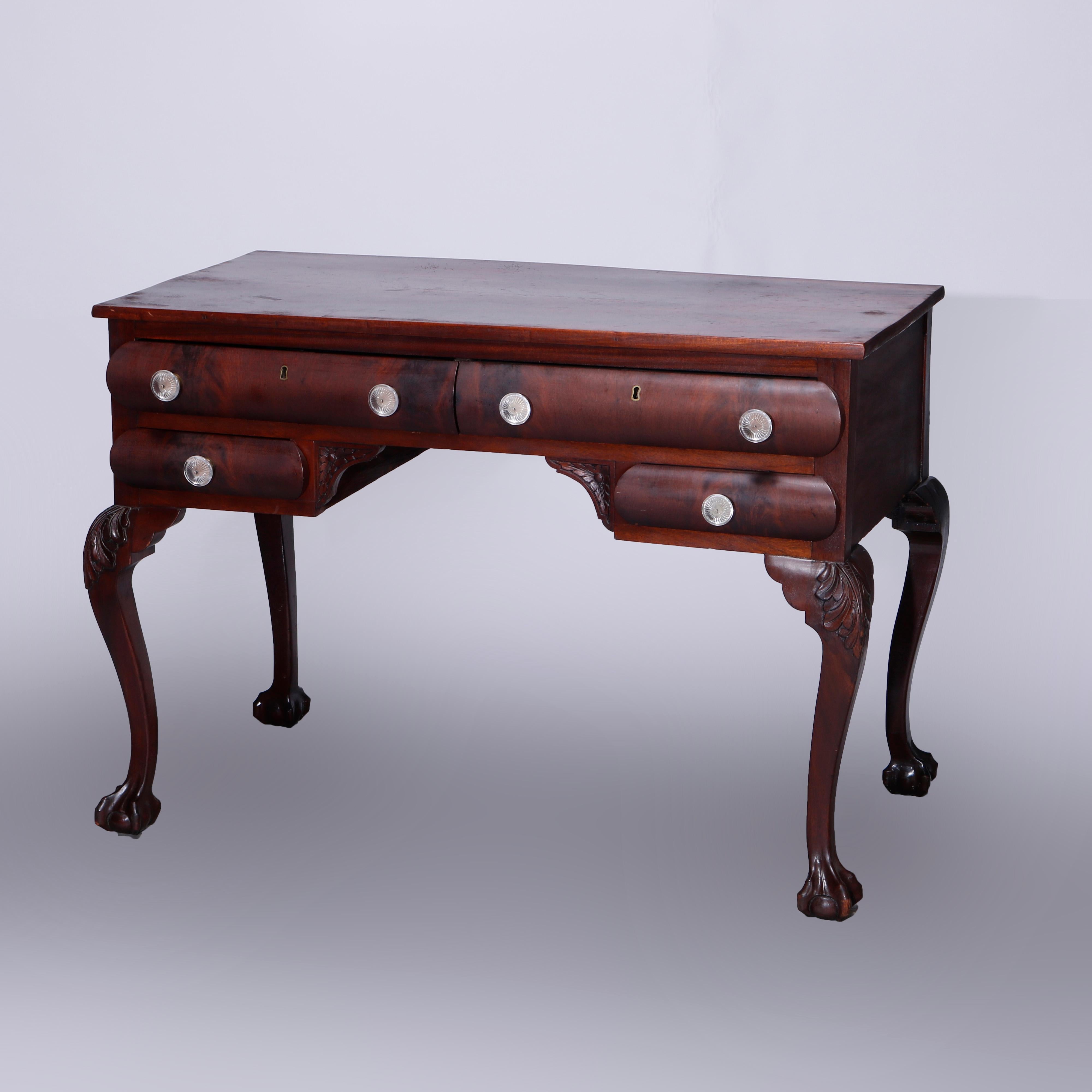An antique Chippendale style writing desk offers mahogany construction with double upper drawers over two smaller drawers, raised on cabriole legs with carved acanthus knees terminating in claw and ball feet, c1900

Measures - 30.5''H x 42.25''W x