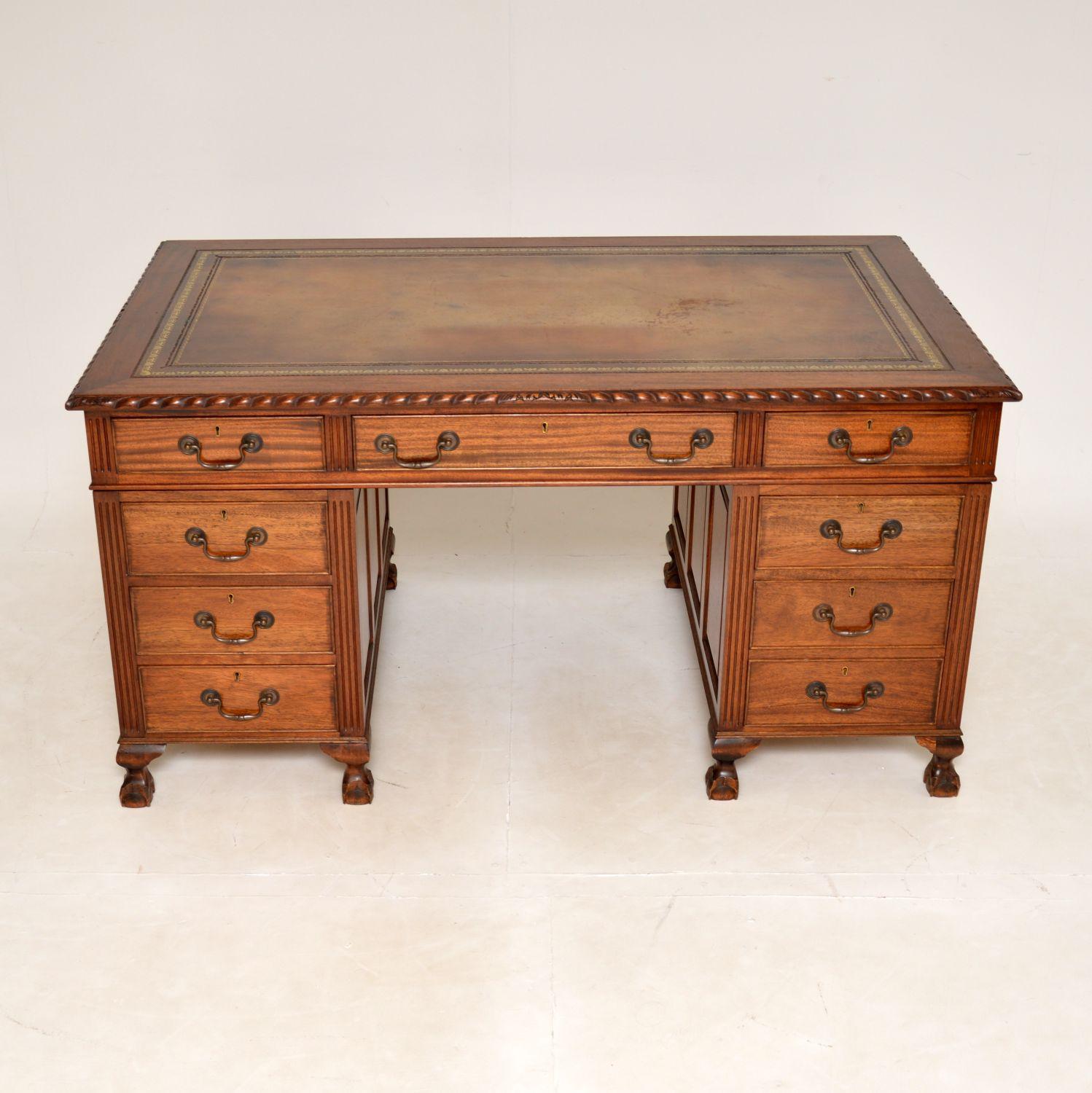 An impressive & large antique desk in the Chippendale style. This was made in England & we would date it from around the 1930’s period.
It is of superb quality and has lots of lovely features. The inset leather top is also of great quality, it is