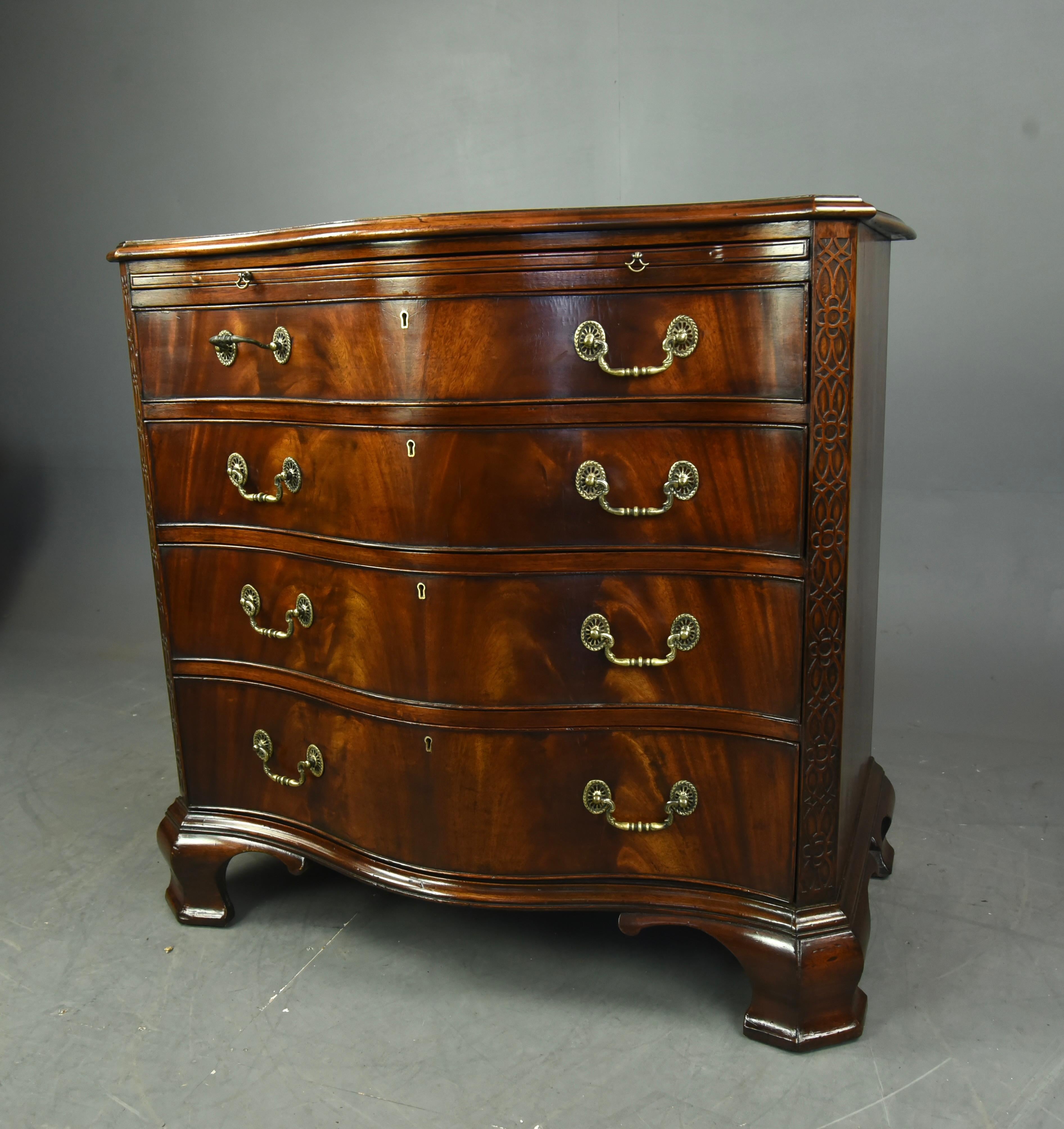 Wonderful Chippendale style mahogany serpentine chest of drawers circa 1900. 
The chest is in very good condition with four oak lined hand dovetailed drawers and a brushing slide ,with wonderful engraved swan neck handles ,supplied with a single