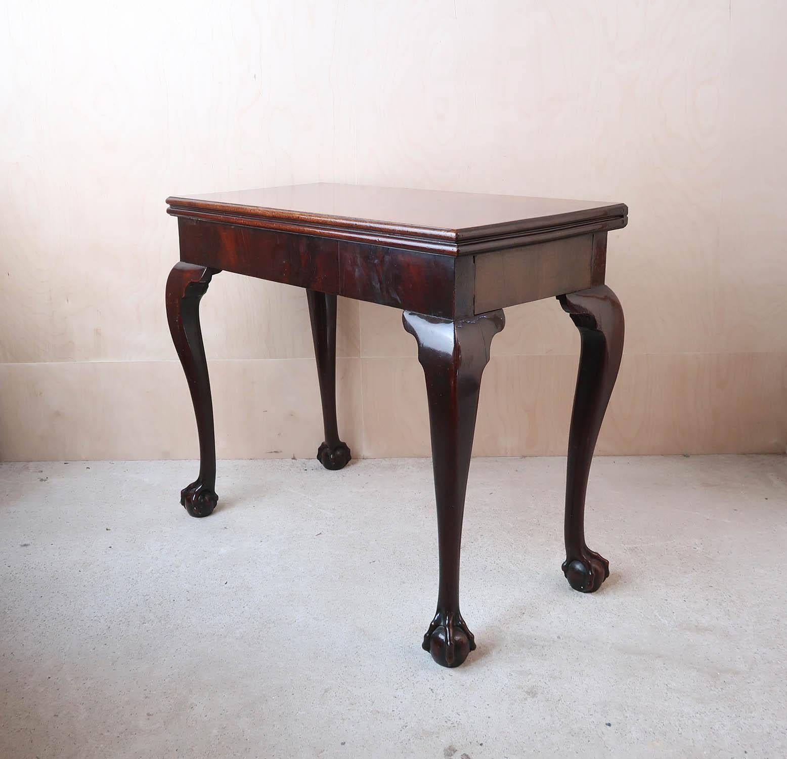 Wonderful Georgian side table

Beautiful timber with lovely figure and grain. All solid tropical hardwood apart from thick veneer on the apron.

Lovely quality carving to the claw and ball feet.

The top folds over so it can be used as a centre