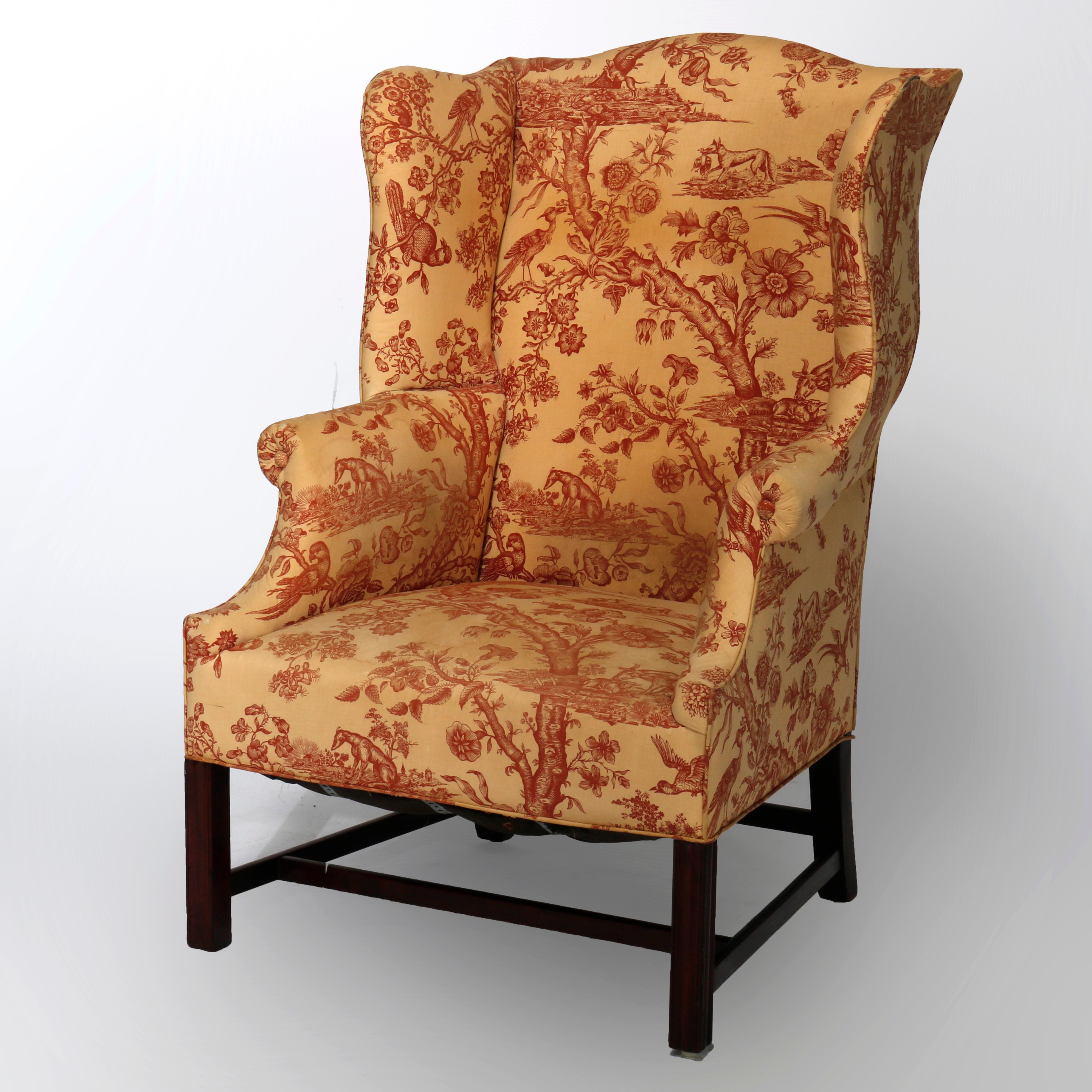 An antique Chippendale upholstered fireside armchair offers shaped wingback over scroll form arms and raised on straight and square legs, c1780

Measures- 47.5''h x 30''w x 34''d