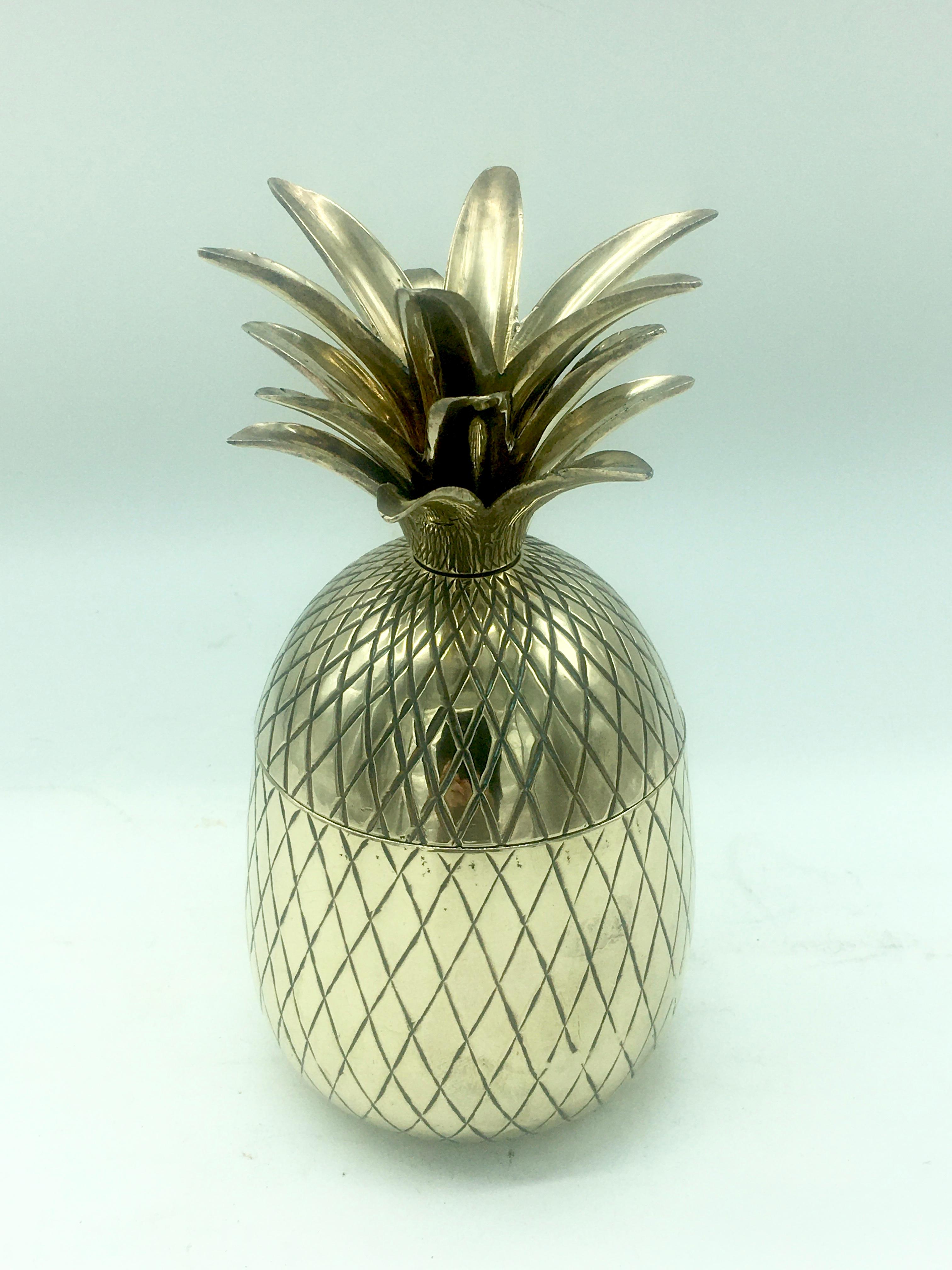 Chiselled brass and gilt pineapple box caddy, circa 1970.

Good quality decorative piece used for storage in the form of a pineapple. Splits in half to reveal a gilded interior.

 