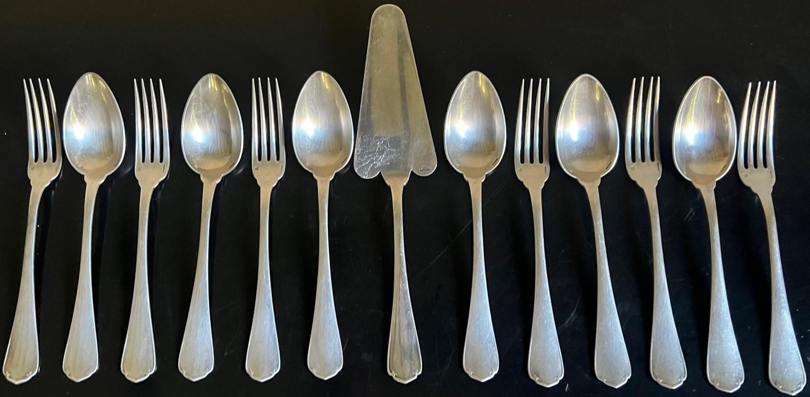 Christofle antique flatware set of six spoons and six forks as well as one vintage pie /cake server included. The spoons and forks were made in France in the early 1900's and the cake server around the 1940's.

Spoons- 8.25