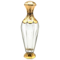 Flacon de parfum ancien en verre de cristal antique avec touches d'or