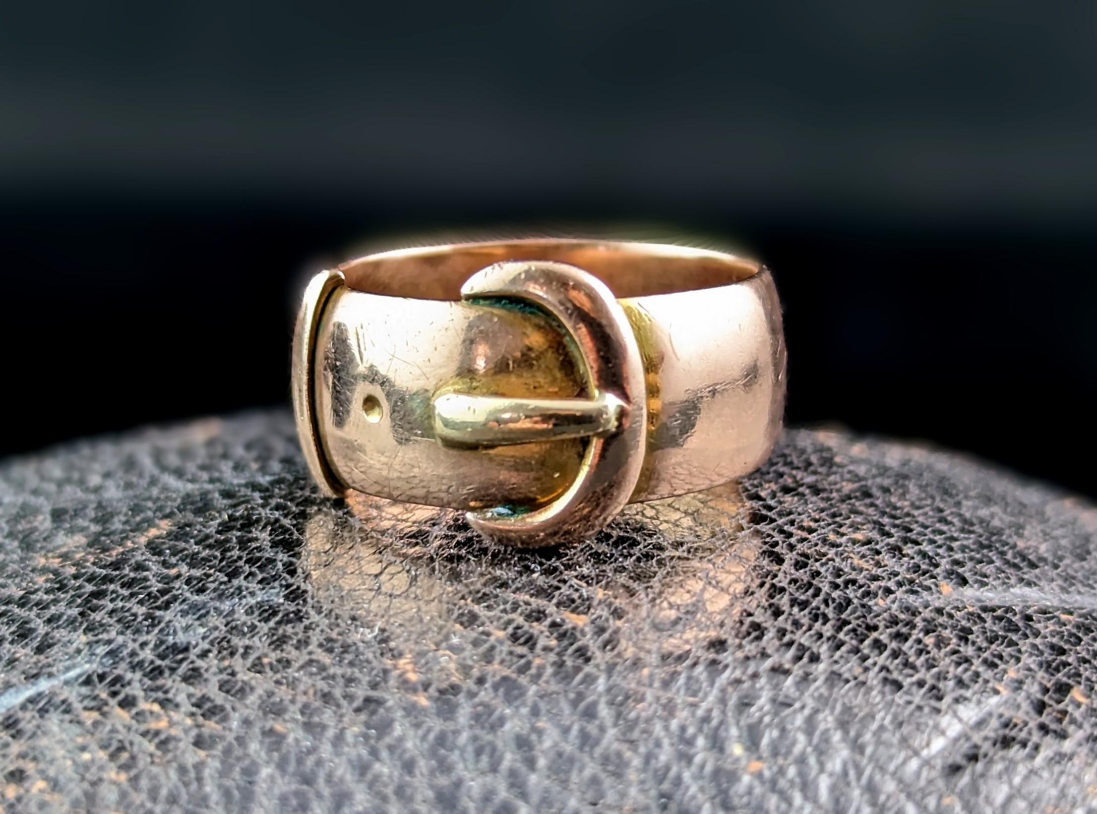 You cannot go wrong with a good antique gold buckle ring and the chunkier the better in our opinion.

It is a wide cigar band style but with a light D profile and a buckle design to the face, the buckle traditionally symbolises holding someone close