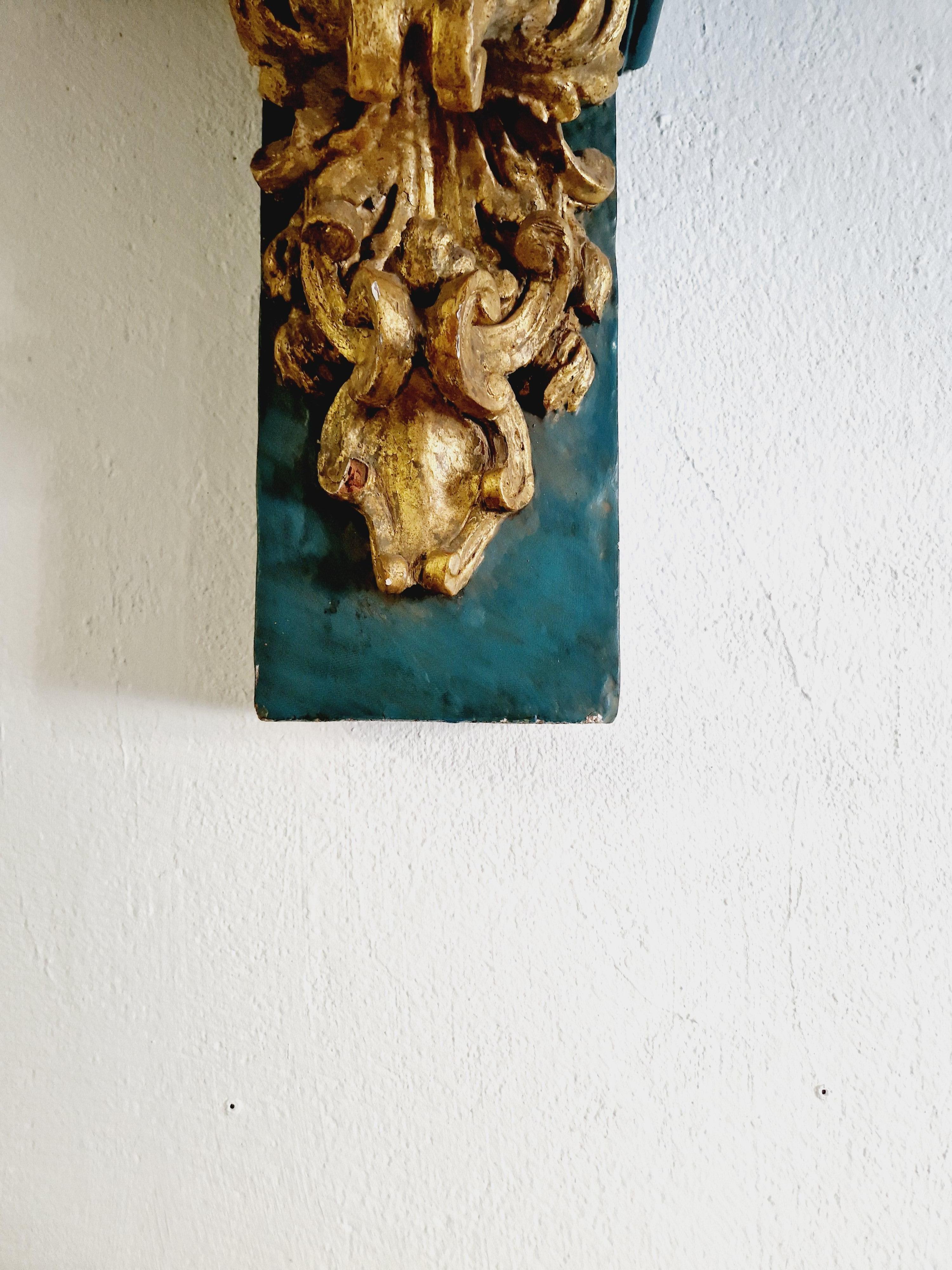 This Fabulous Church Console Shelf sourced from a Church in the south of France

Turquoise Polychromed wood of French origin. To the front of the console are beautiful carved details of a Tete de Angelot.

Circa mid 19th century, the console can is