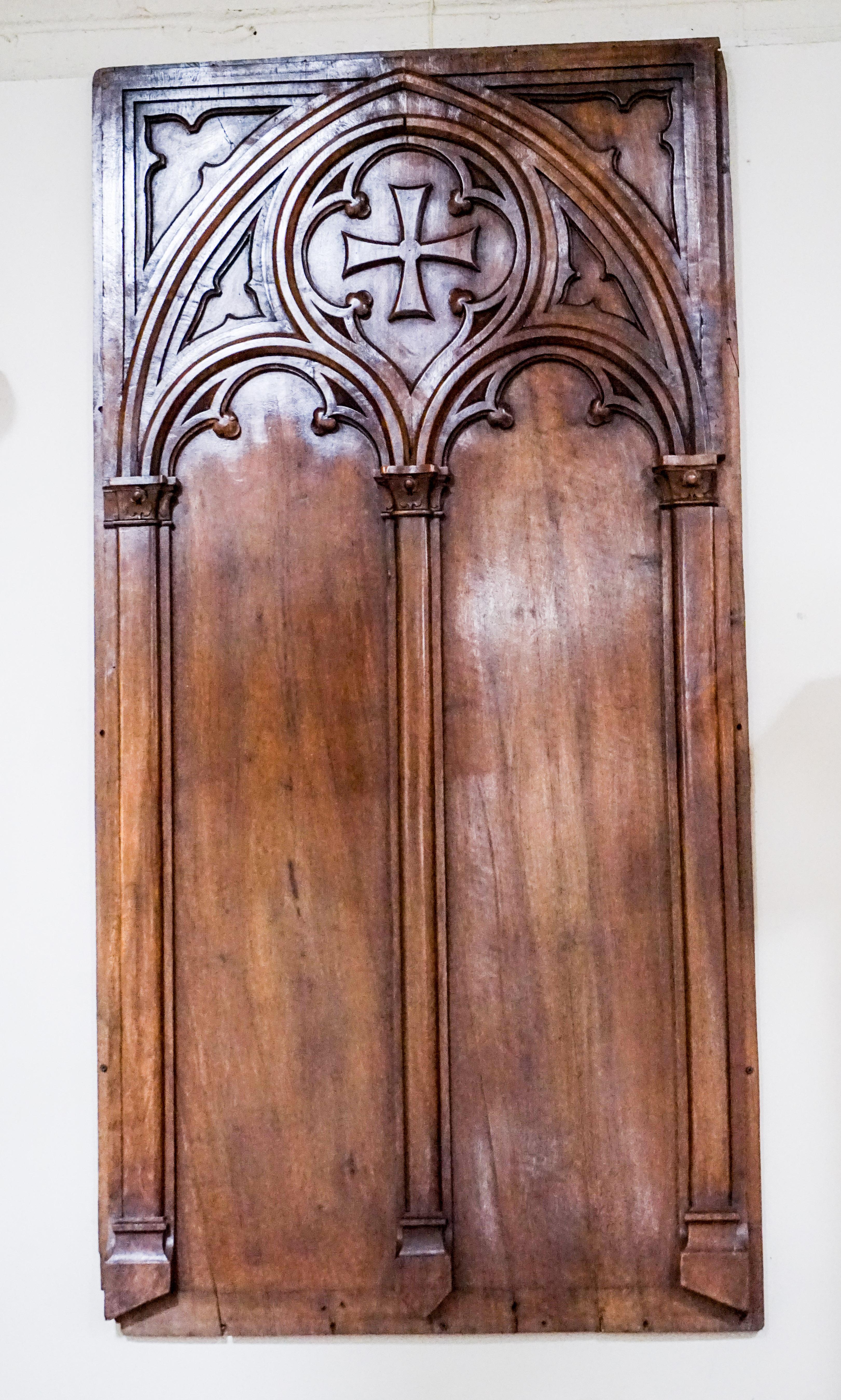 Small antique church door made of walnut. French from the early 1800s.

Measurements: 
60'' H x 30'' W x 1.5'' D.