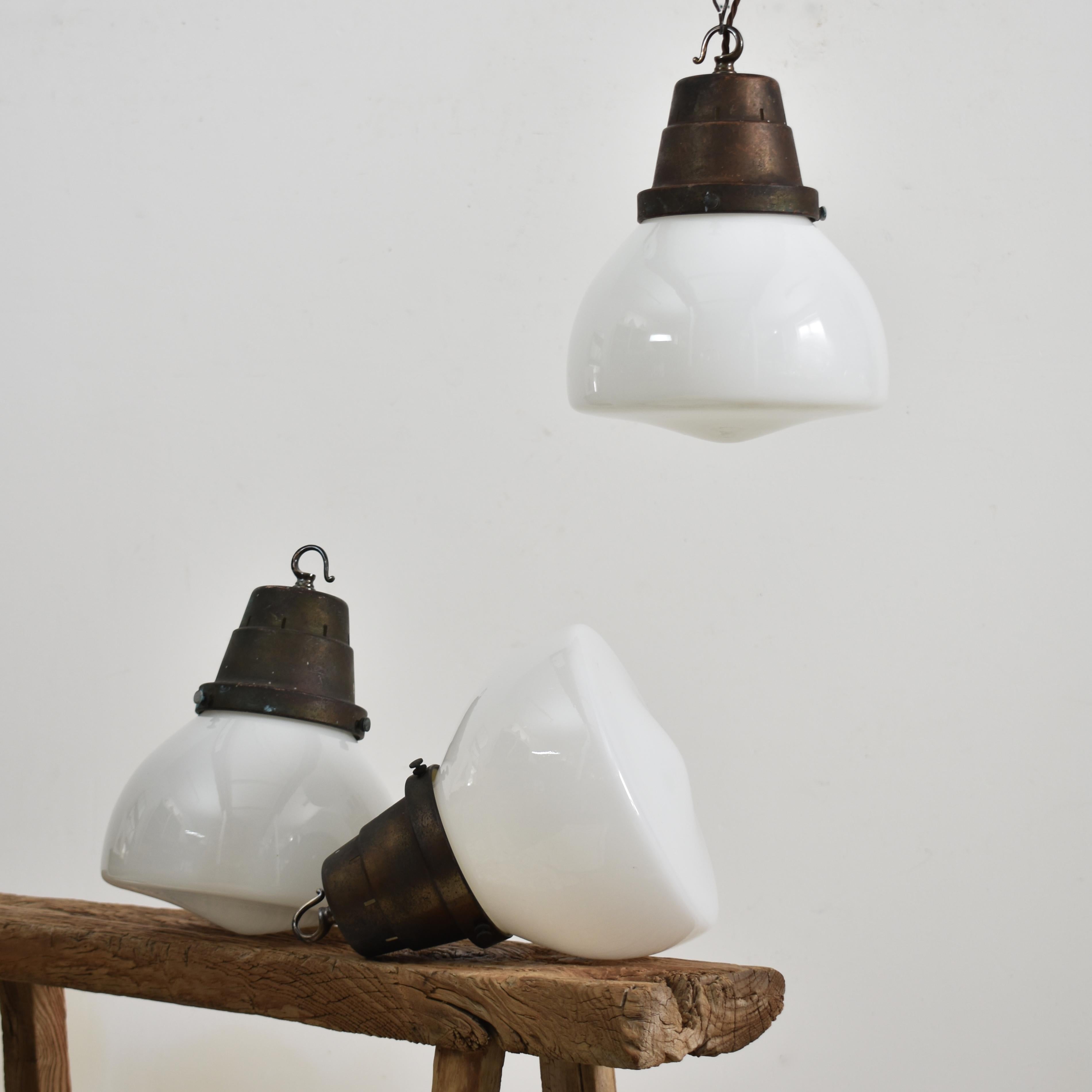 Antique Church Opaline pendant light – R

An original opaline glass pendant light. The light has a milk glass opaline shade and original brass hanging gallery. The gallery finish has been left untouched in it original