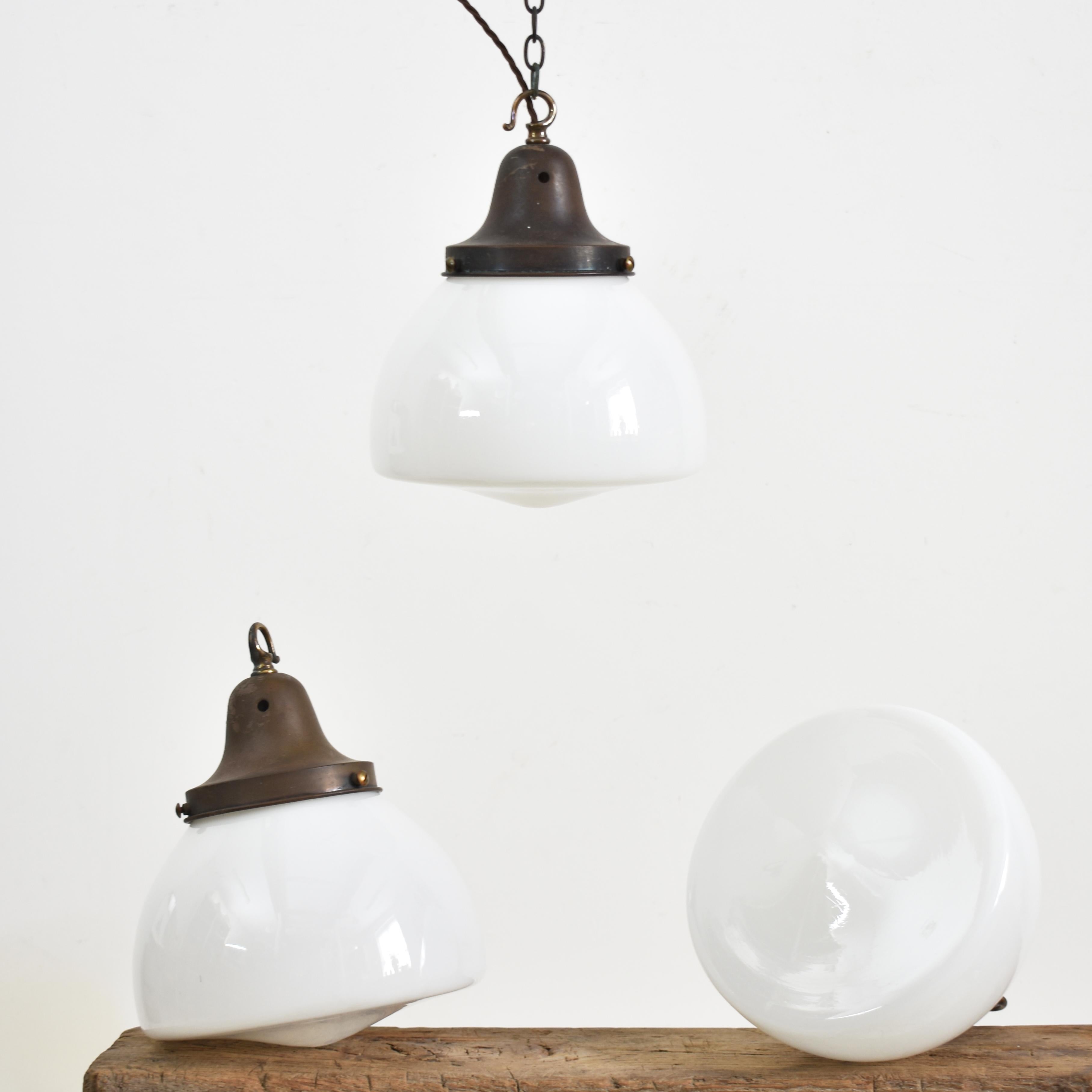 Antique Church Opaline Pendant Light – T

An original opaline glass pendant light. The light has a milk glass opaline shade and original brass hanging gallery. The gallery finish has been left untouched in it original