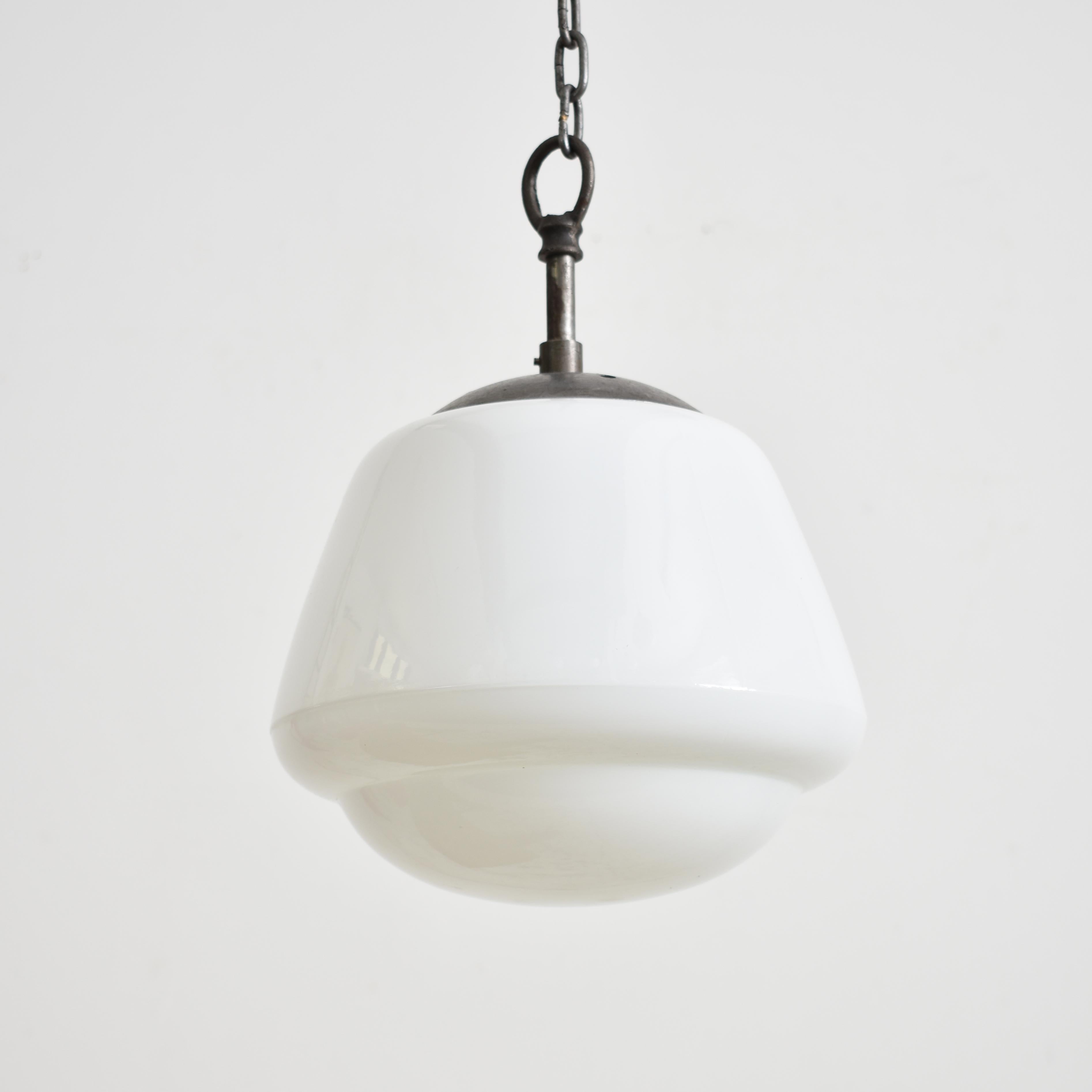 Czech Opaline Pendant Light – A

A vintage opaline glass pendant light salvaged from a school in former Czechoslovakia, featuring a lovely moulded decorative shape. The glass which has a gloss finish provides a striking even glow when illuminated .