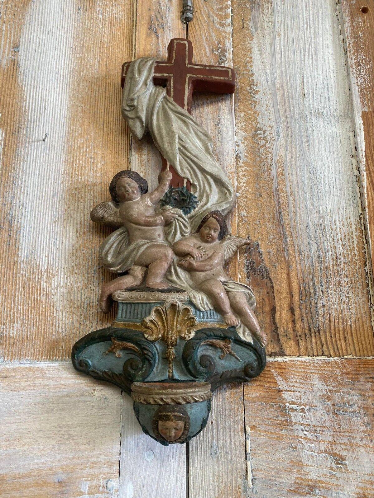 A beautiful Bénitier en terre cross in polychromed metal is of French Origin. With beautiful carved details and vibrant colours.

The piece is Circa 19th Century and displays a rugged  Cross with 2 Angels.

Unique Piece of History

Dimensions
34 x