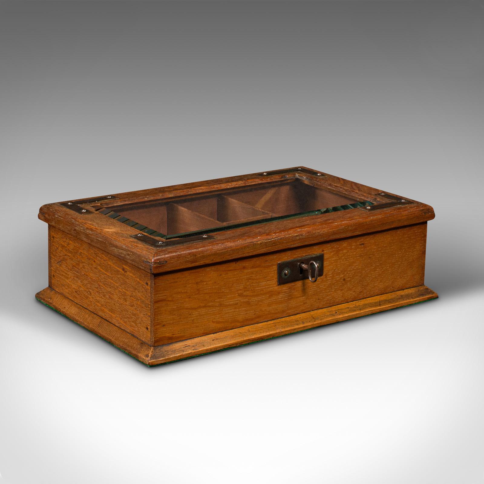 This is an antique cigar humidor. An English, oak and bronze smoker's case, dating to the Edwardian period, circa 1910.

Quality storage for your favourite cigars, with an attractive finish.
Displays a desirable aged patina and in very good