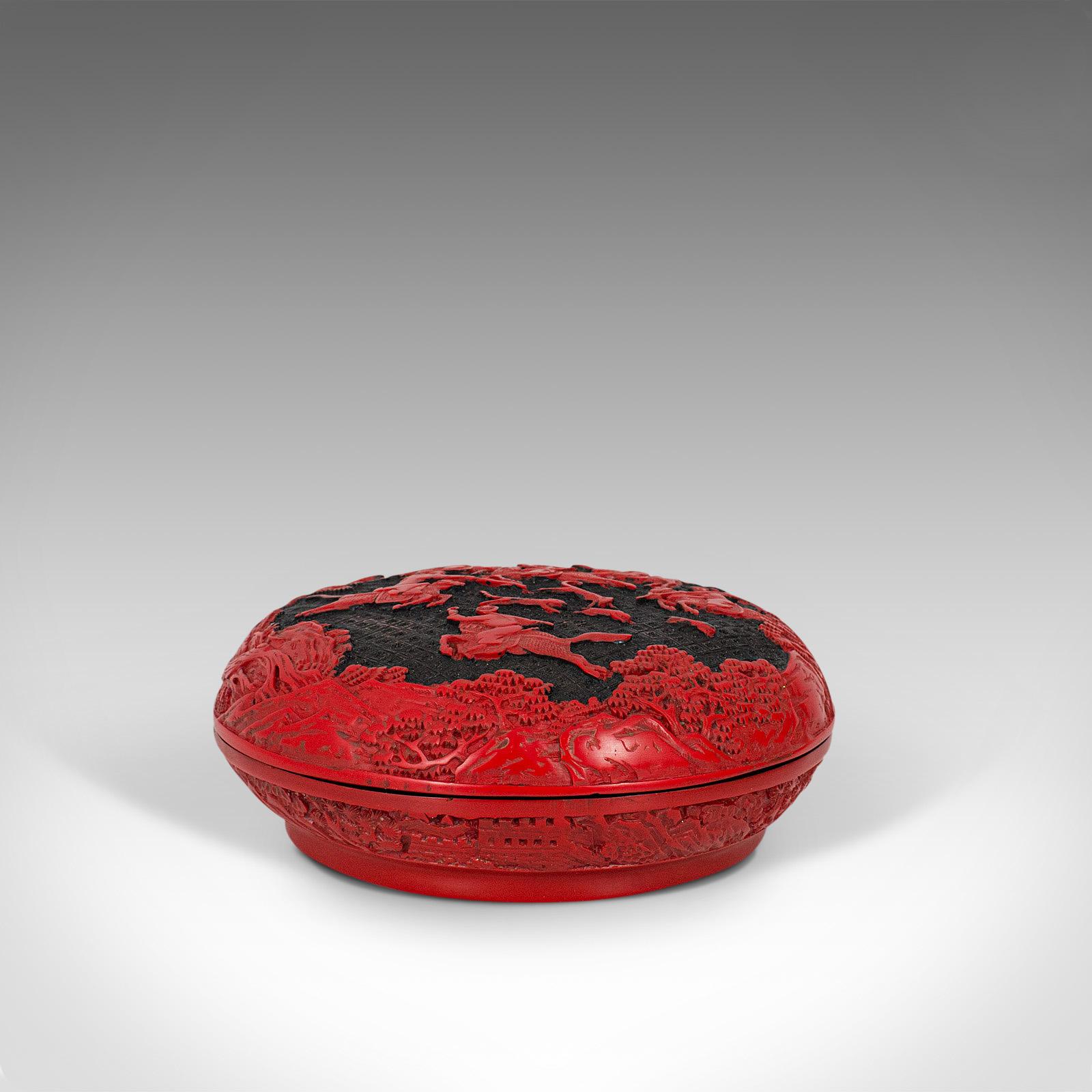 This is an antique cinnabar box. A Chinese, carved lacquer decorative lidded tray, dating to the late Qing dynasty, circa 1900.

Striking example of Chinese decorative arts
Displays a desirable aged patina - in very good order
Profusely carved,