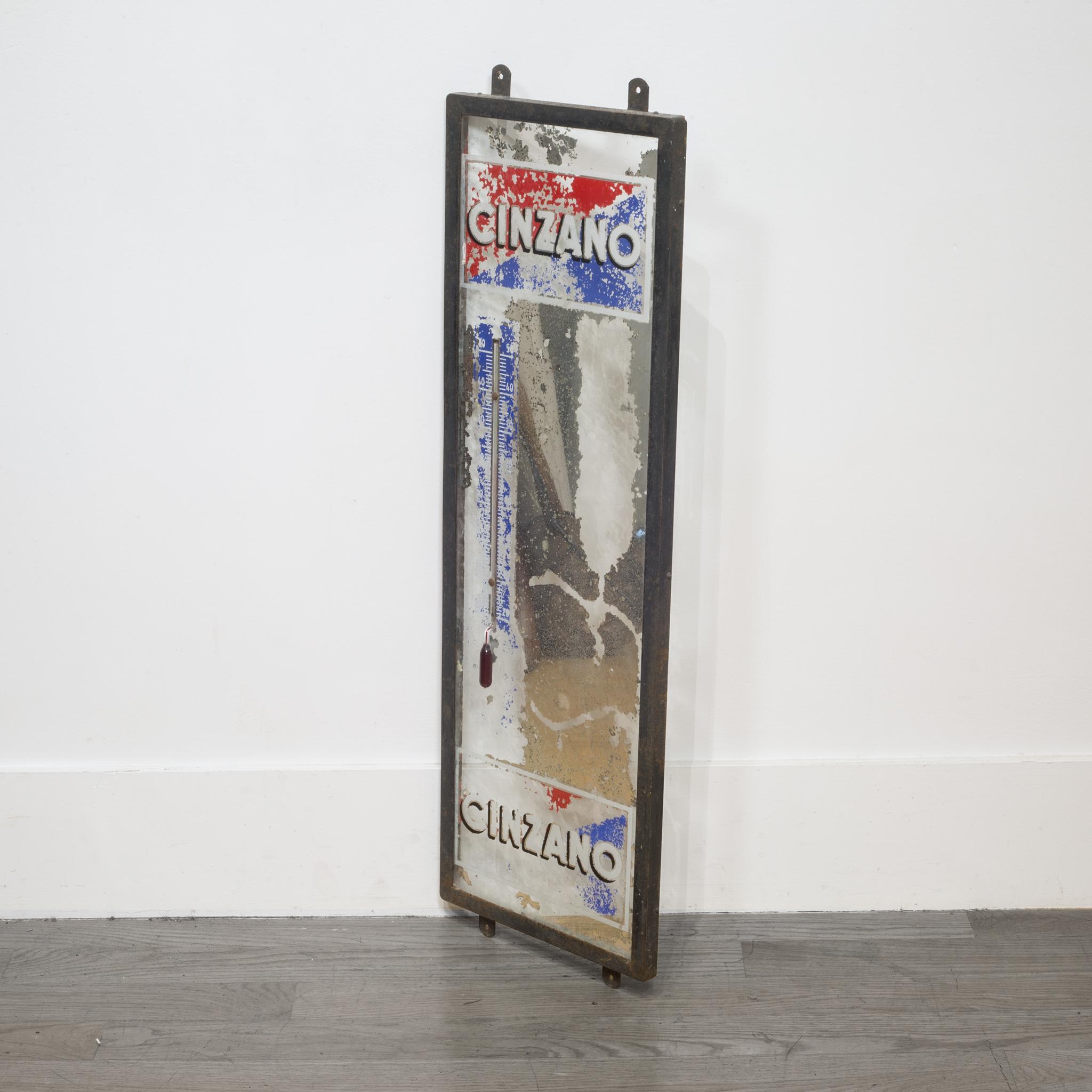 About

This is an original Cinzano advertising mirror with a glass thermometer framed in a steel frame. This piece has retained some of its original paint and the mirror is in distressed condition. The glass is intact with no chips. The