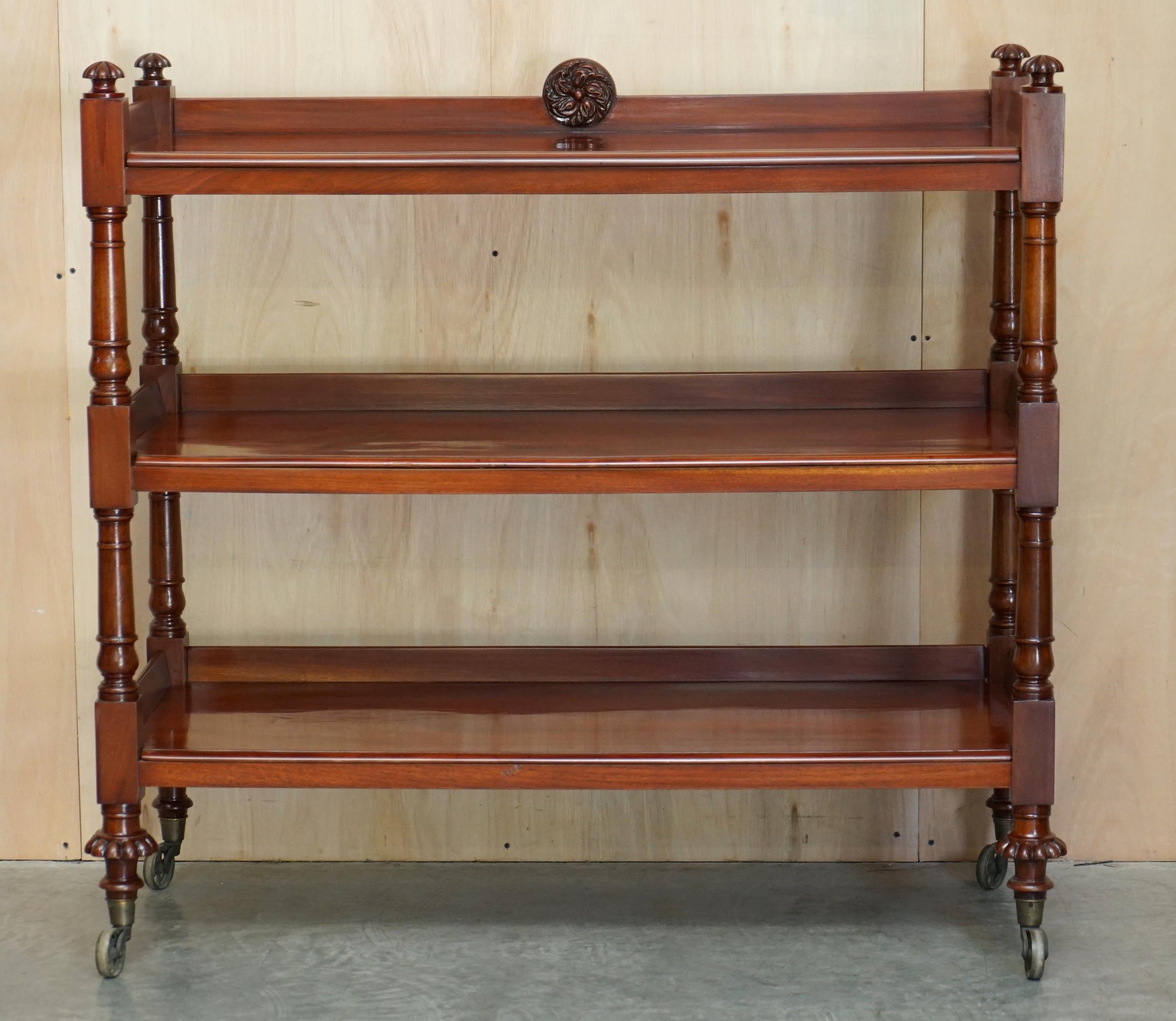 We are delighted to offer for sale this very fine original circa 1840 English mahogany library bookshelf trolley on oversized William IV wagon wheels.

A good looking well made and decorative piece, this trolley can be used as a buffet piece or