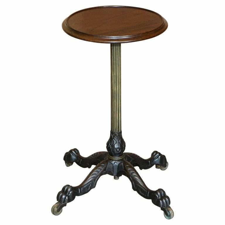 We are delighted to offer for sale this absolutely stunning Hardwood topped brass and cast iron height adjustable side table with oversized lion hairy paw base

A very good looking decorative and well made piece, I have owned this personally for the