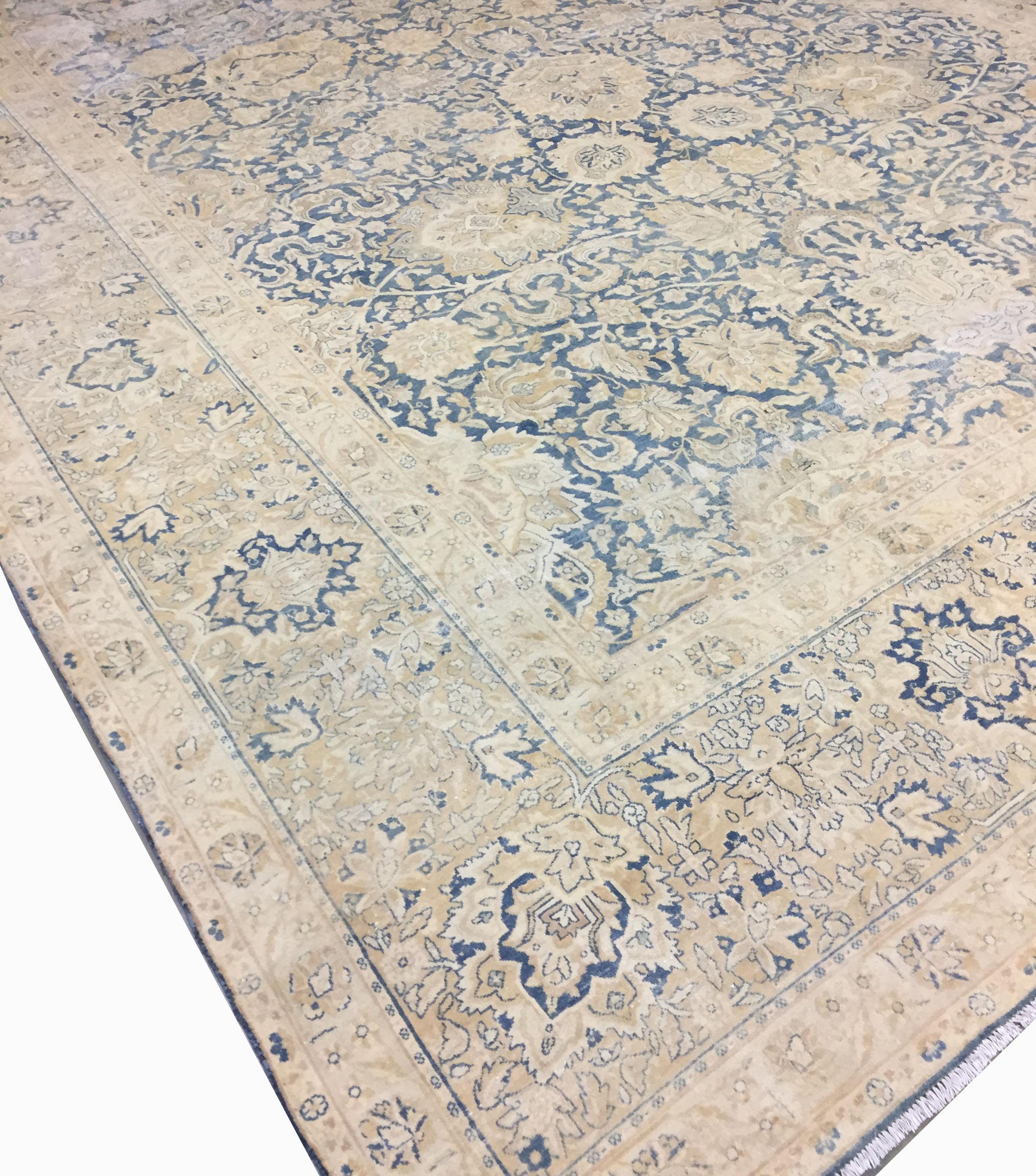 9'10 x 13'. From Kirman in Persia this is an antique, circa 1890 hand knotted rug. The condition is distressed, shabby chic. The rug is solid but with low pile and a distressed look that adds to its beauty and charm. The rug has a solid foundation