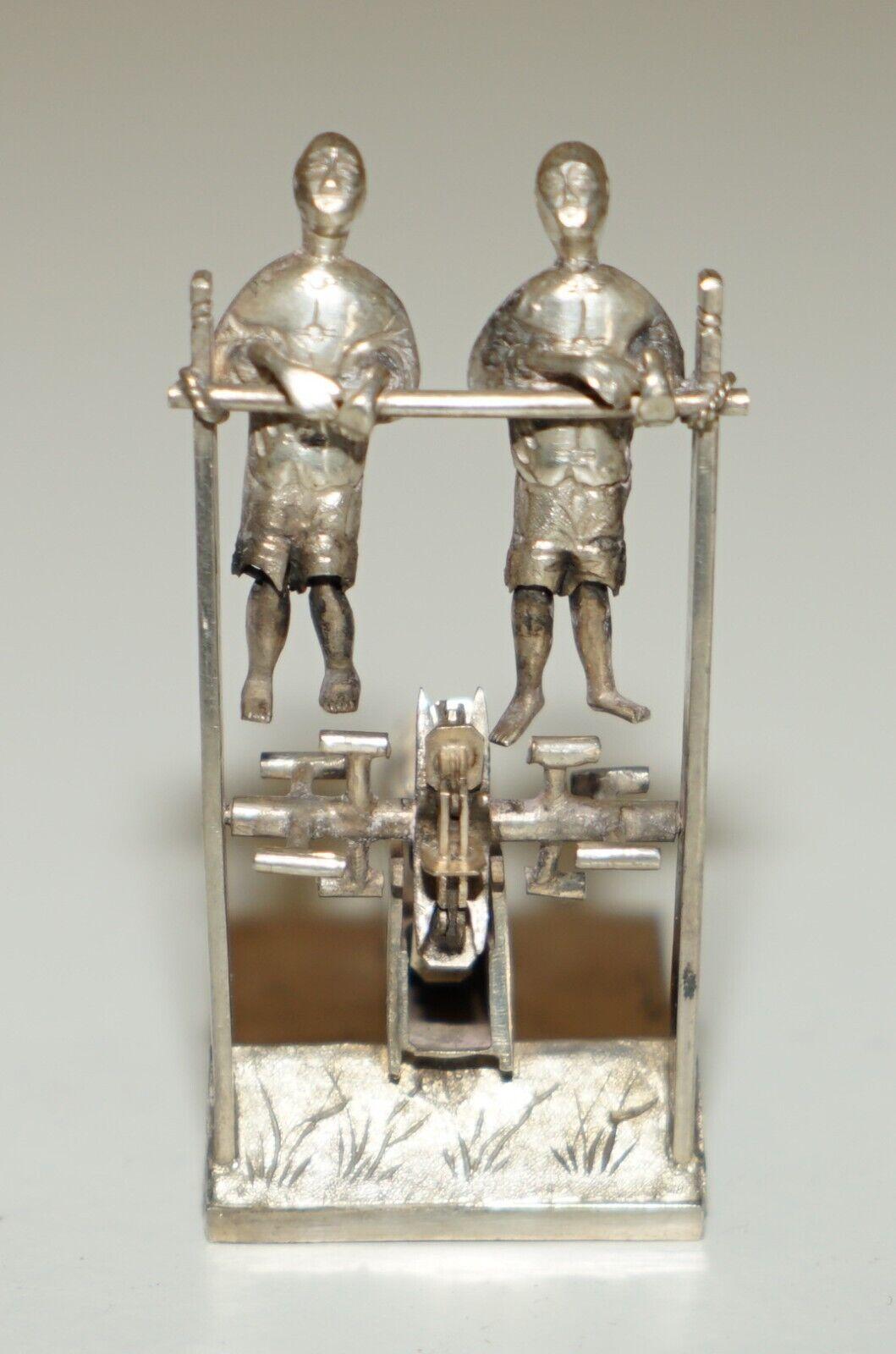 High Victorian ANTIQUE CIRCA 1890 CHINESE STERLiNG SILVER STATUE OF MEN PEDDLING WITH A CHAIN For Sale