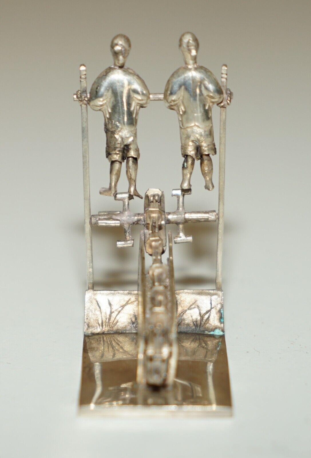 Late 19th Century ANTIQUE CIRCA 1890 CHINESE STERLiNG SILVER STATUE OF MEN PEDDLING WITH A CHAIN For Sale
