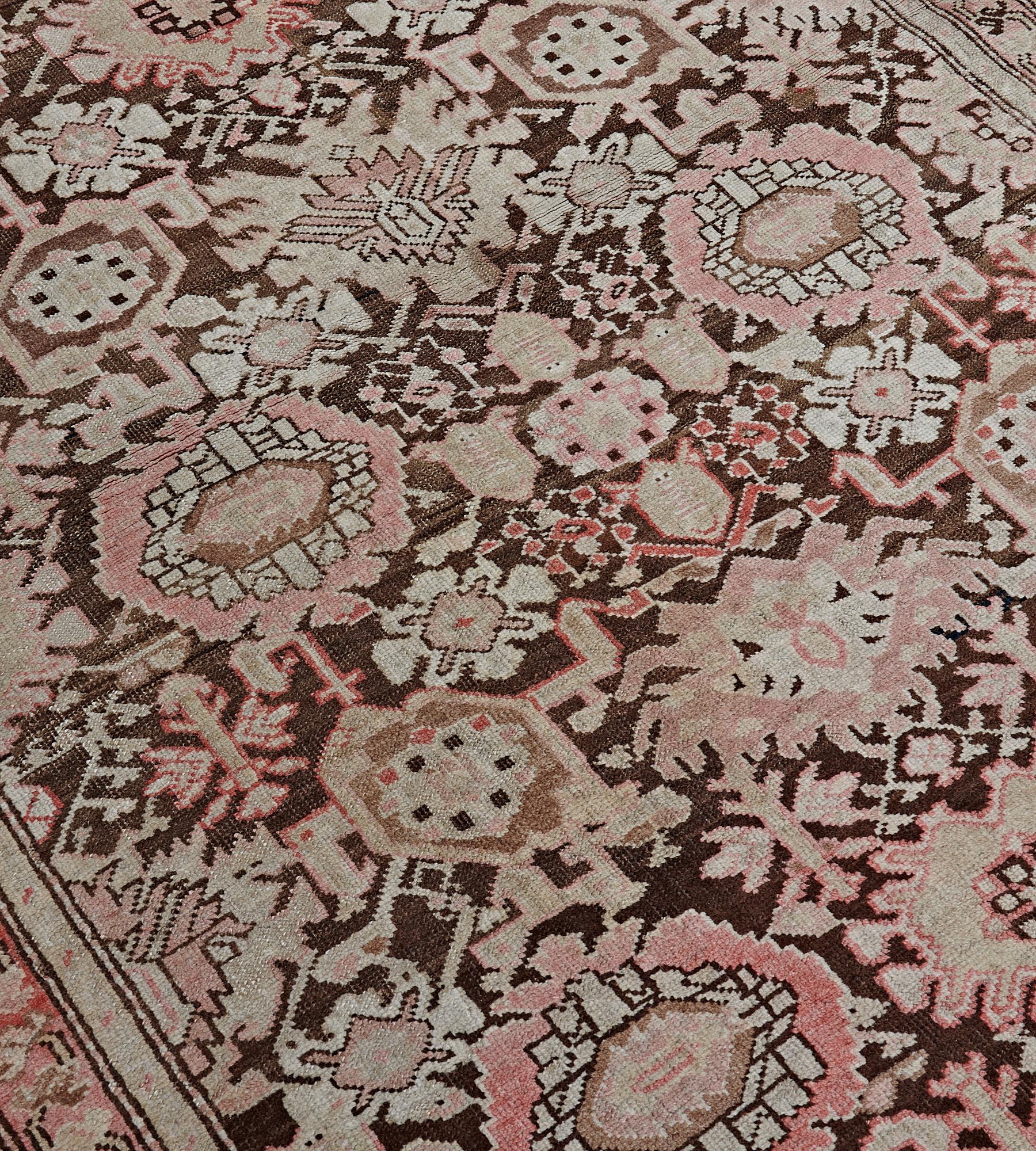 This antique, circa 1900, Caucasian Karabagh runner has a shaded chocolate-brown field with an overall dense dusty-pink, fox-brown and ivory bold palmette and floral vine, in a shaded tomato-red border of angular floral vine between ivory similar