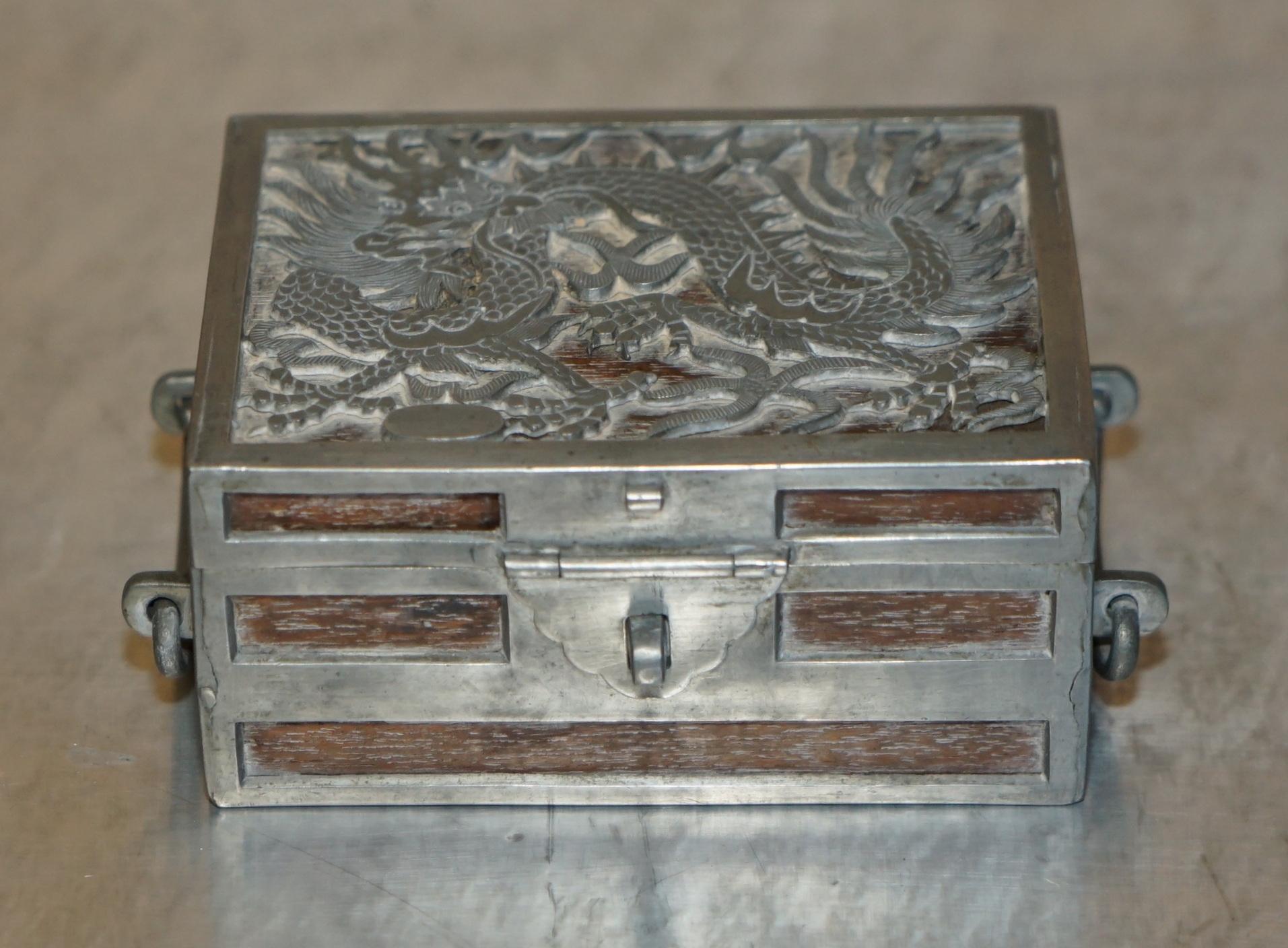 Royal House Antiques

Royal House Antiques is delighted to offer for sale this exquisite Kut Hing Chinese Pewter & Mahogany carved and embossed jewellery trinket box

A good looking well made and super decorative piece, originally designed for