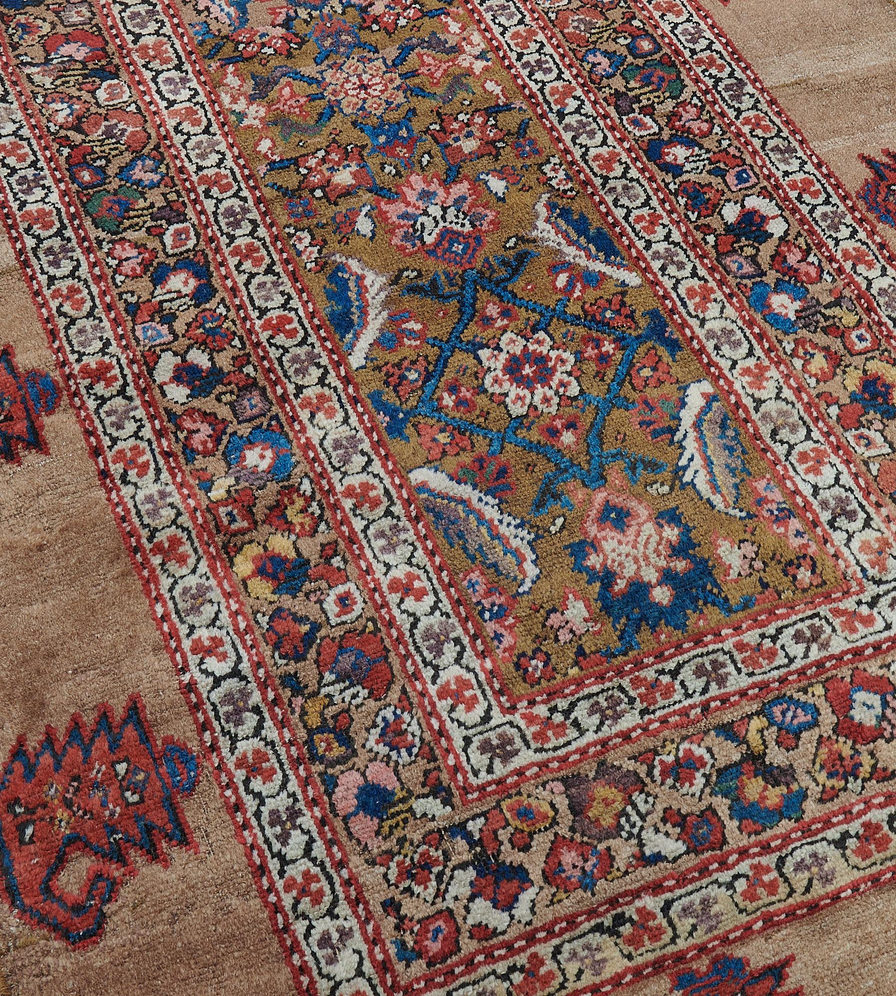 This antique, circa 1900, Serab runner has a caramel-brown narrow field with an overall design of polychrome bold herati-pattern with bold serrated leaves at each side, in a buff-brown border of brick-red, sandy-yellow, dusty-pink, ivory and