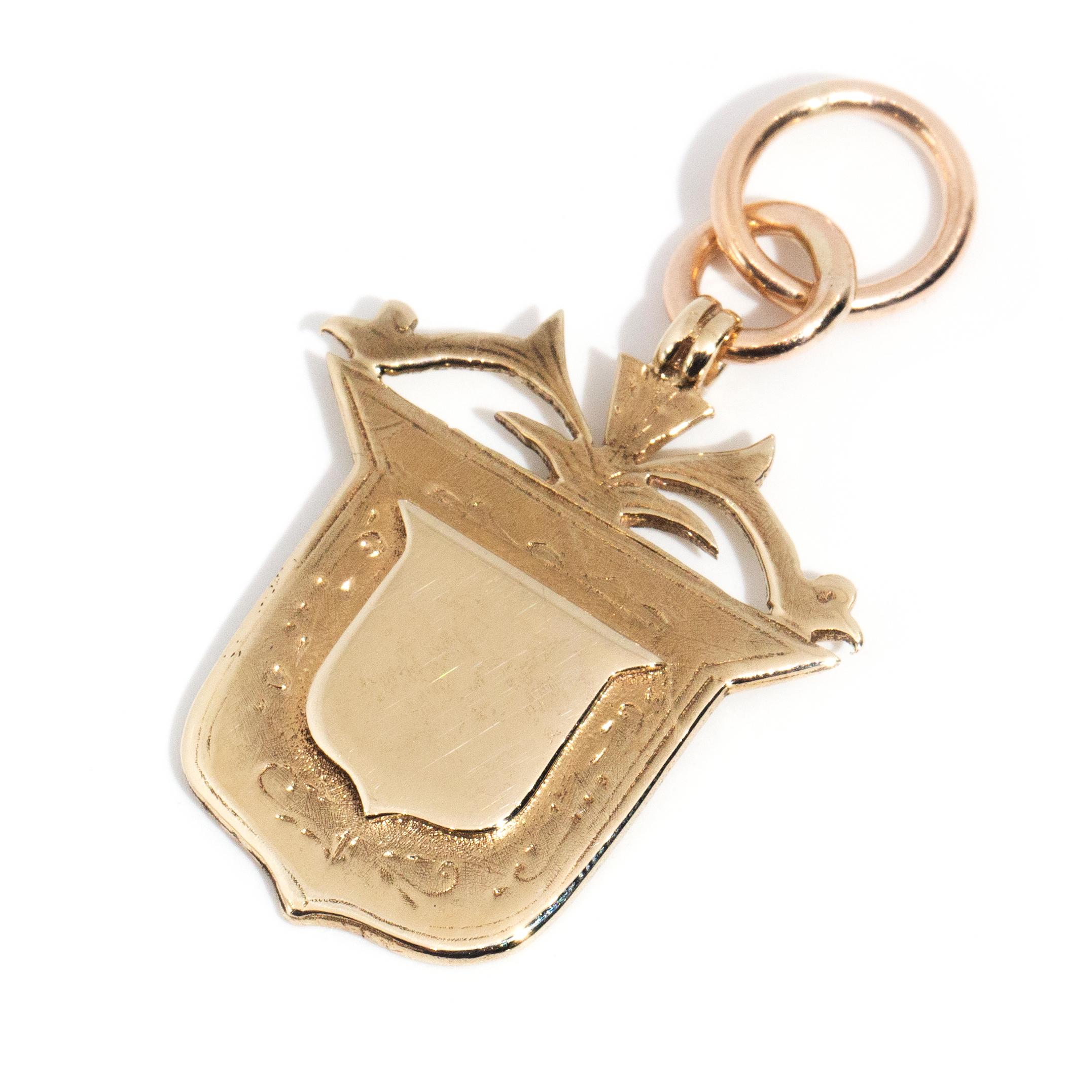 gold shield pendant