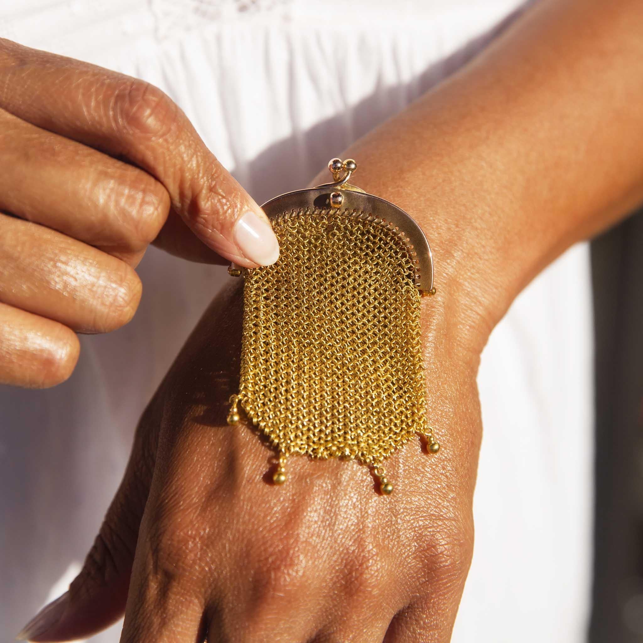 An antique French mesh coin purse, crafted of 9-carat rose gold in the early 1900s, is a testament to Edwardian elegance and a time when gloved fingers of fashionable ladies brushed shimmering mesh as they retrieved coins for a cup of tea at a
