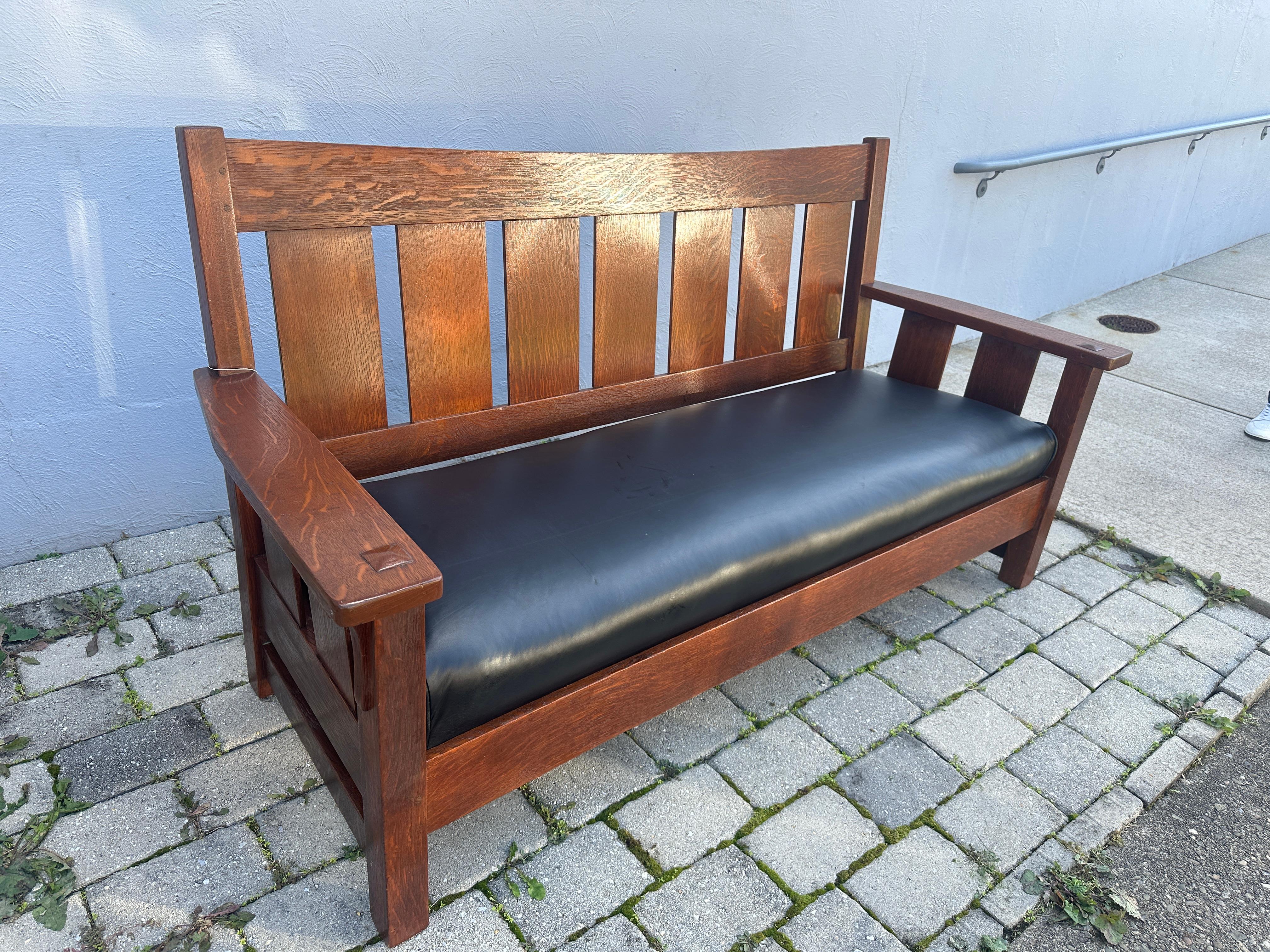 This is a PERIOD circa 1910 Arts and Crafts settle sold in the store in Boston MA
call PAIN furniture.
Pain furniture sold mostly furniture by STICKLEY AND by 