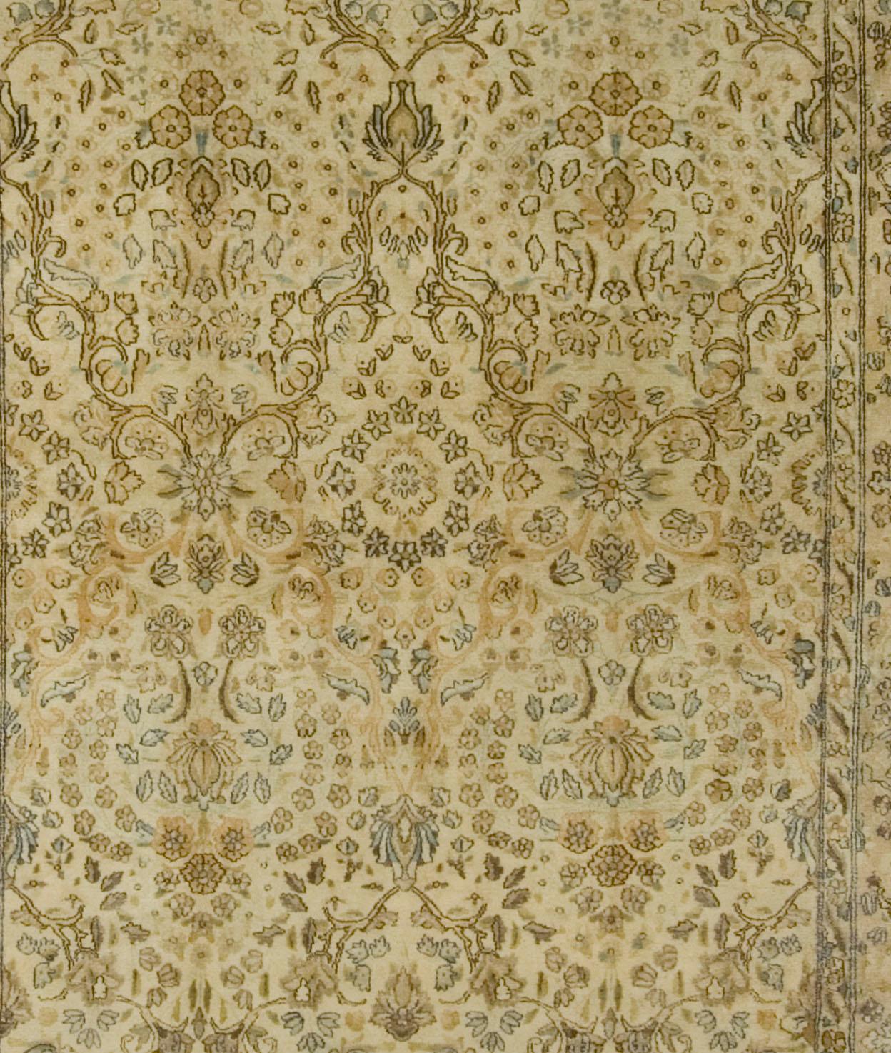 5' x 8'9. Kirman carpets are like no other Persian carpets. For centuries there has been an independent design trend in Kirman in southeast Persia. This unusual small format carpet has a field well covered with tiny flowers, diminutive palmettes and