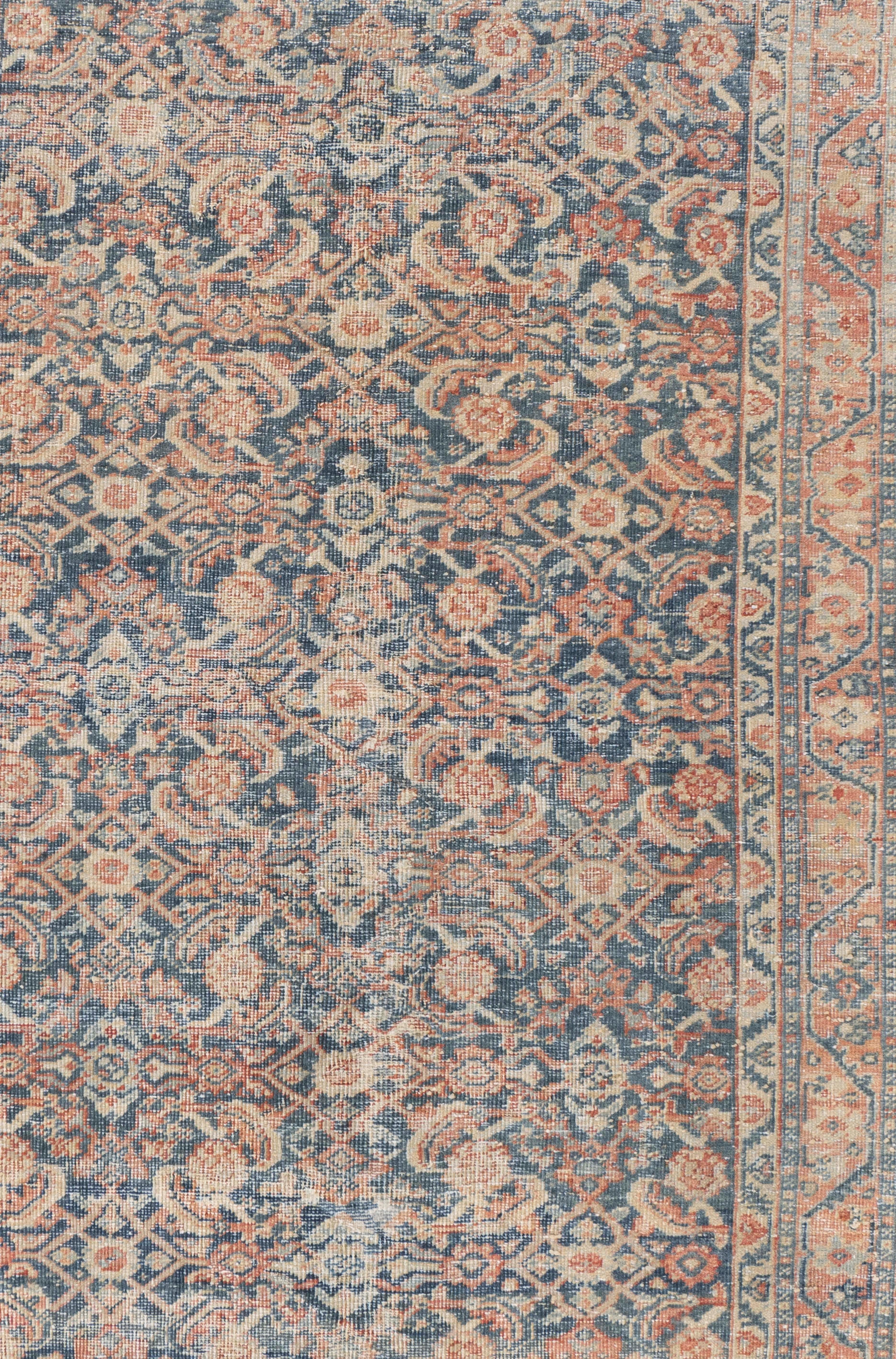 Antique Circa 1920 Blue Persian Mahal Hand Knotted Rug 4' X 6'. Mahal means many things in the rug world. The antique Persian carpets from the British firm of Ziegler with large scale allover patterns in the most desirable soft color’s: rust, ivory,