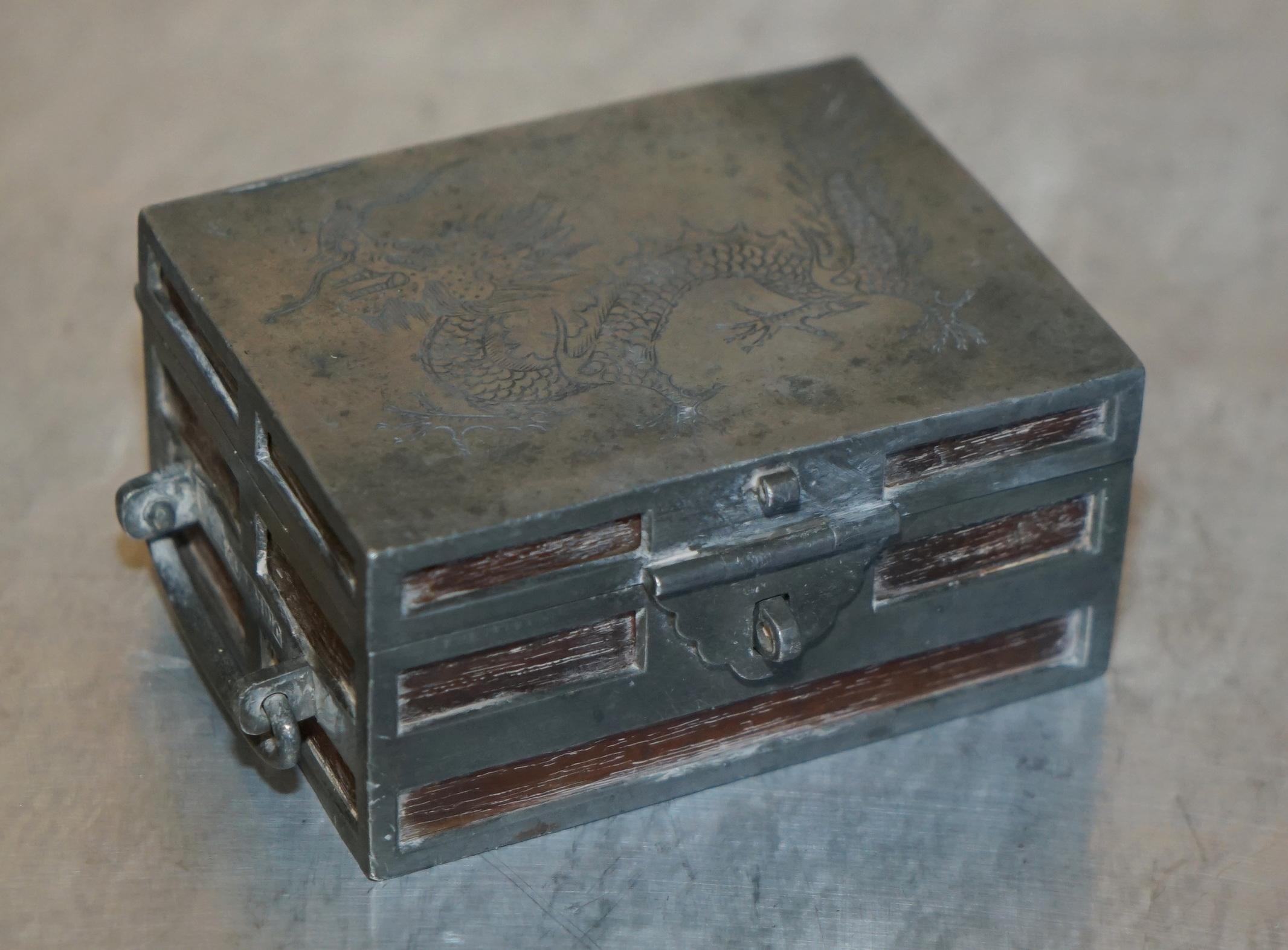Royal House Antiques

Royal House Antiques is delighted to offer for sale this exquisite Circa 1920 Kut Hing Chinese Pewter & Mahogany carved and embossed jewellery trinket box

A good looking well made and super decorative piece, originally