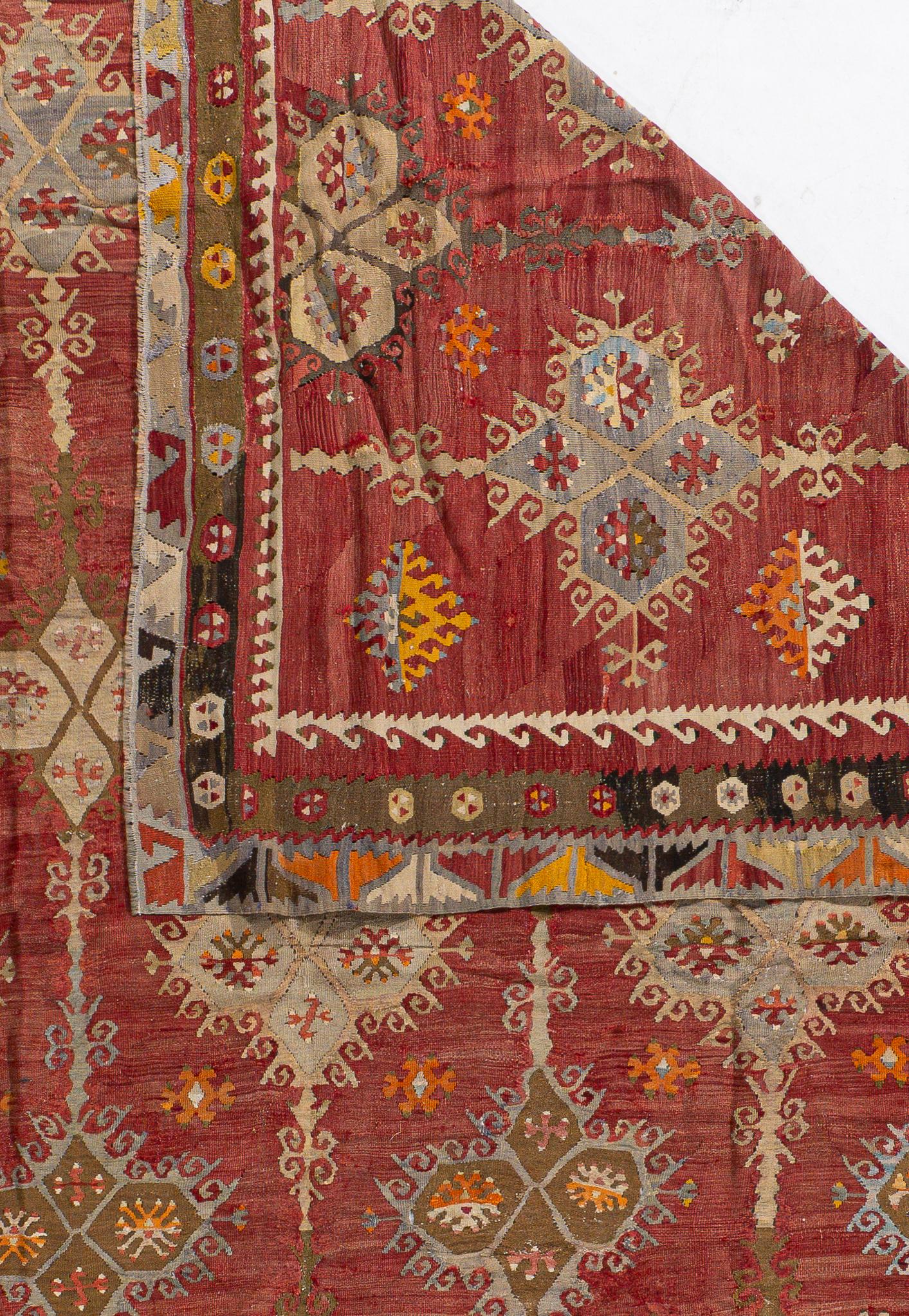 9'3 X 11'4. This vintage Turkish flat weave Kilim is hand-woven. The simplicity and boldness of this piece can also give a contemporary feel and is able to look at home in both a modern and traditional setting. The geometric design in soft colors is
