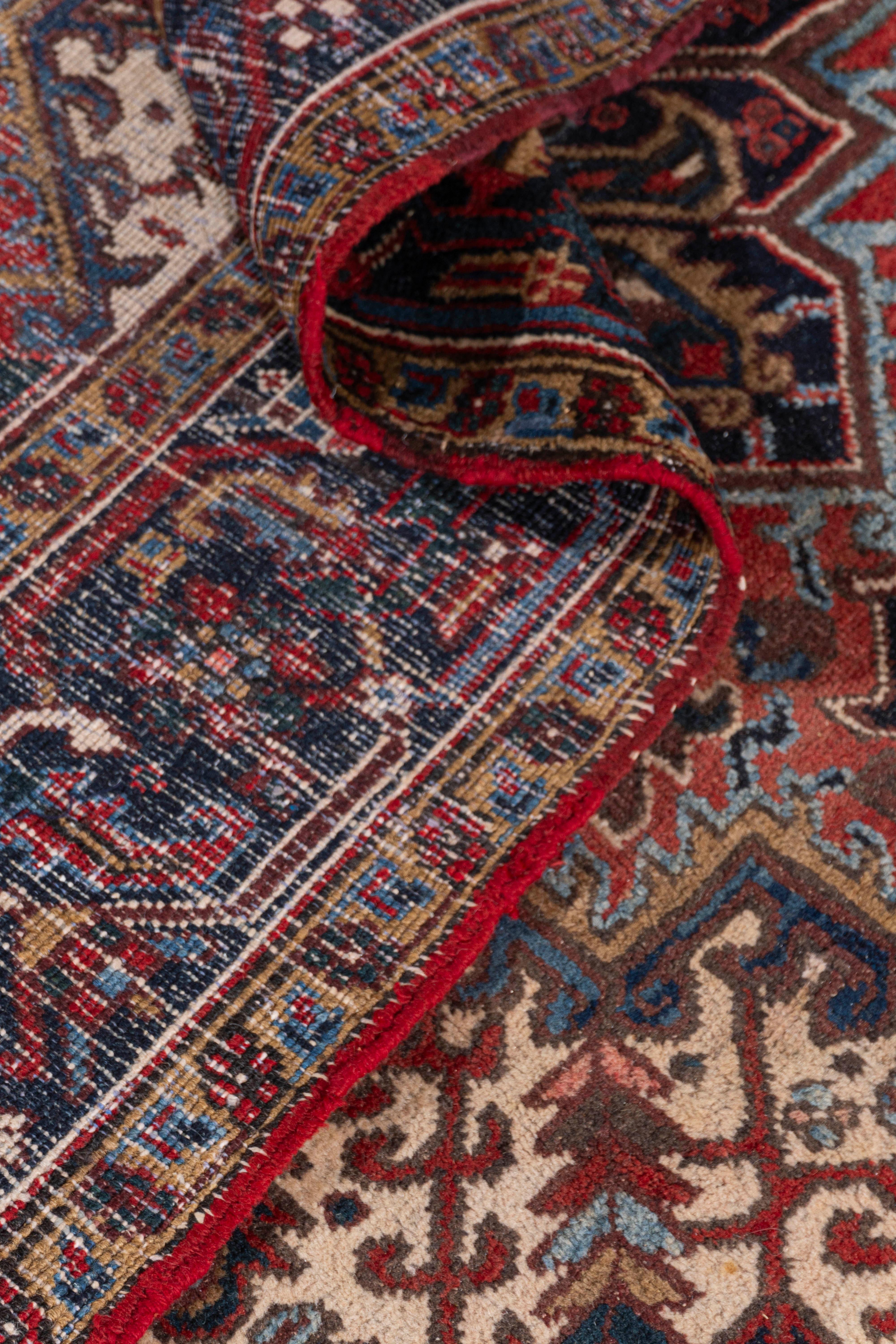 5'11 X 7'4. As perpetually fashionable as they are collectible, traditional Heriz luxury handmade rugs are skillfully woven in vibrant colors and emphatic geometric designs. The Heriz district of NW Persia has been weaving carpets for over a