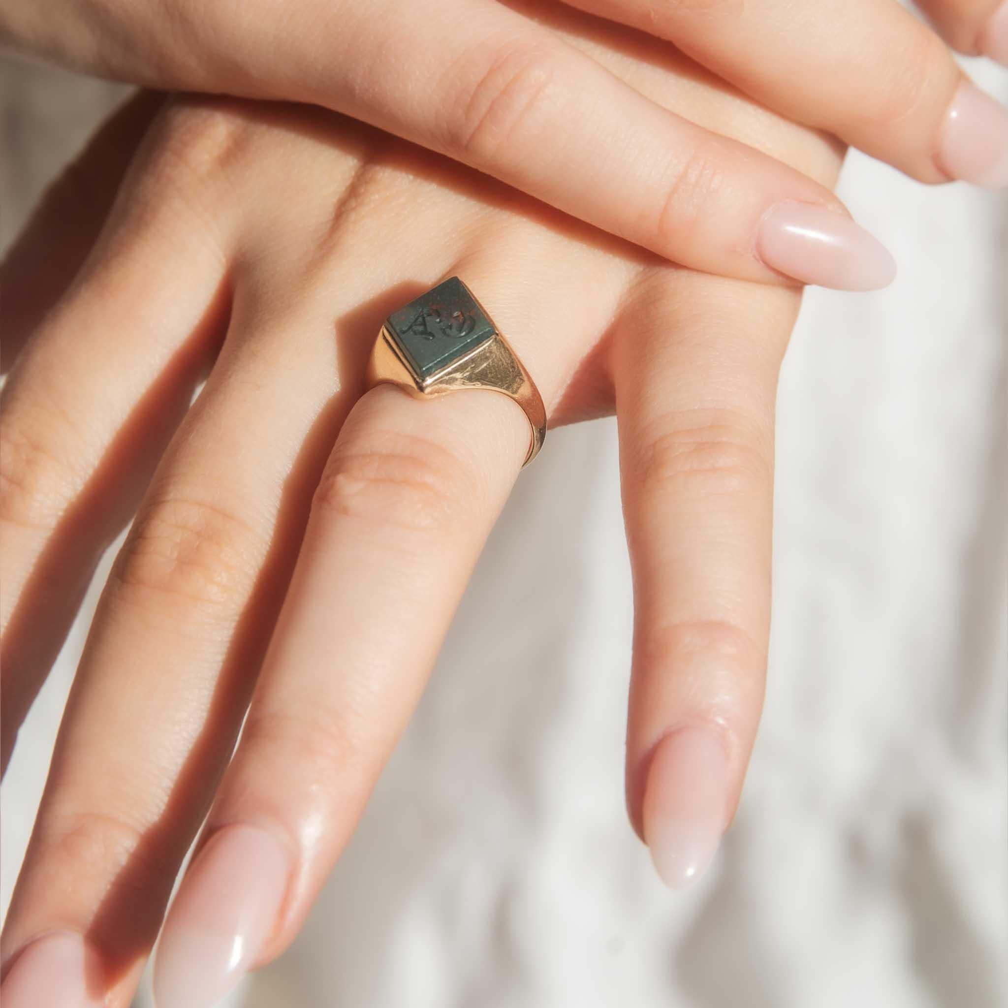 A bold and stylish 1920s antique jewel - our Jame Ring is crafted in 15 carat rose gold.  Her diamond cut bloodstone with speckles of orange red is framed in rich smooth gold, all shine and softened angles. A handsome inclusion in any jewellery
